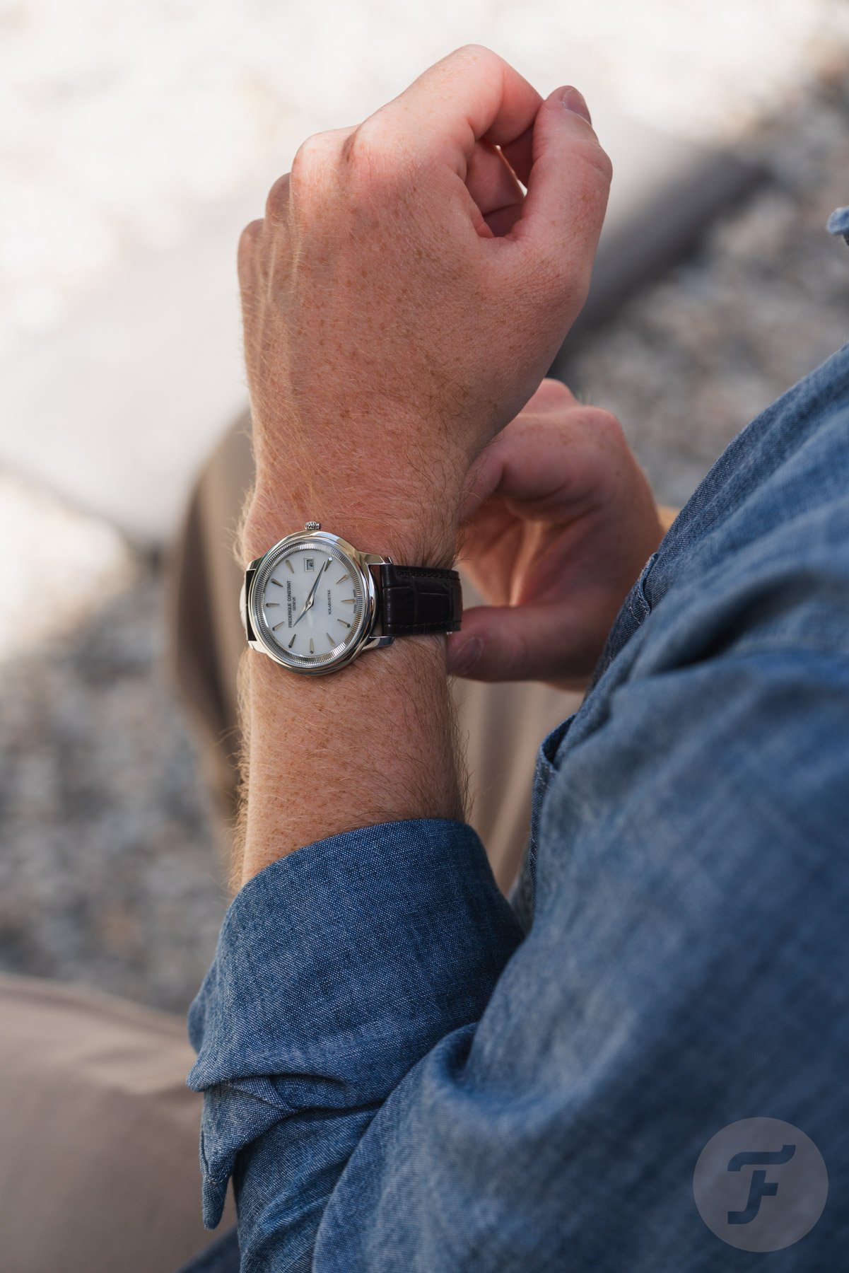 strapping on the white-dial Frederique Constant Moneta Solarmetre