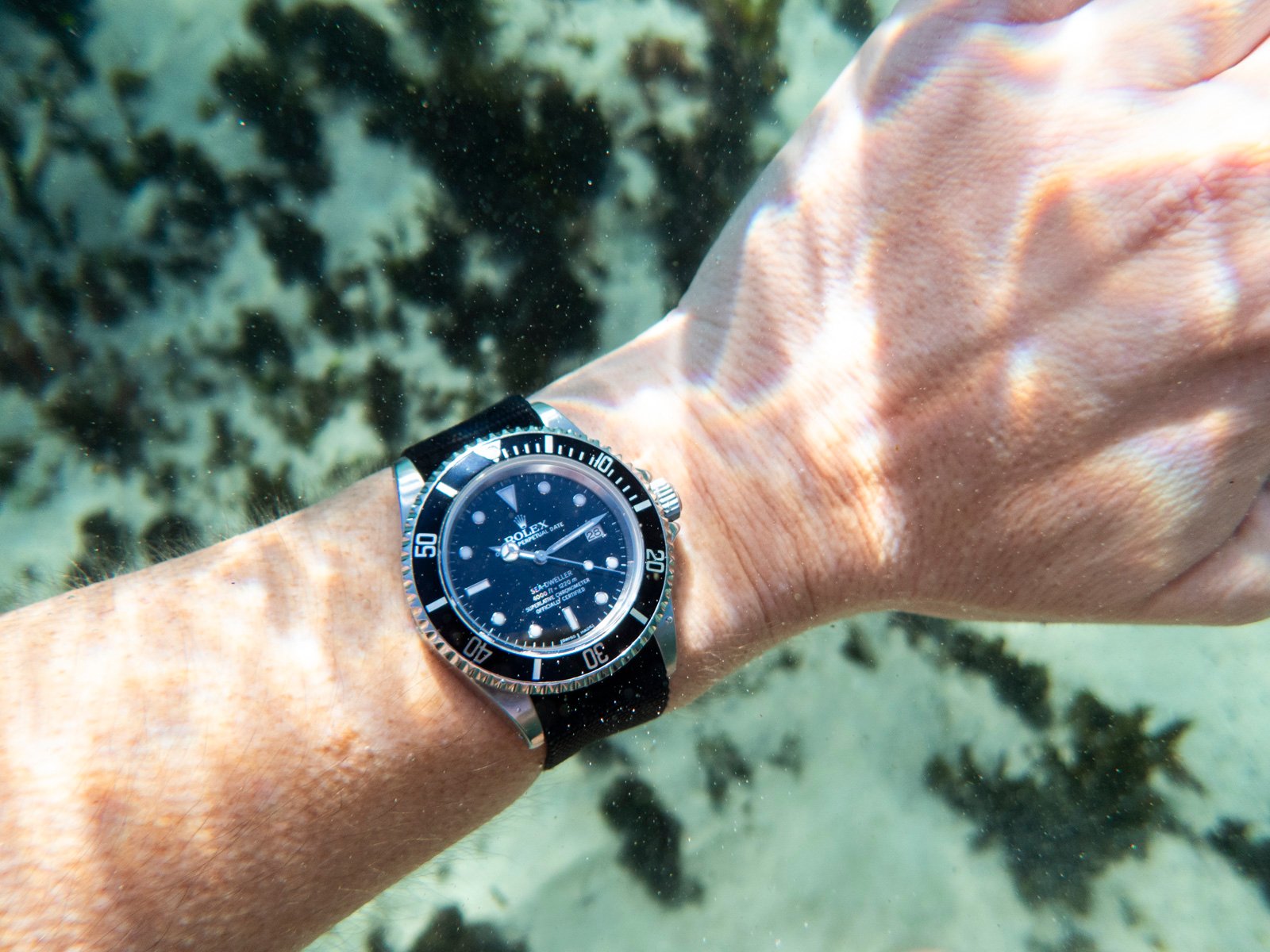 Rolex Sea-Dweller on wrist underwater
