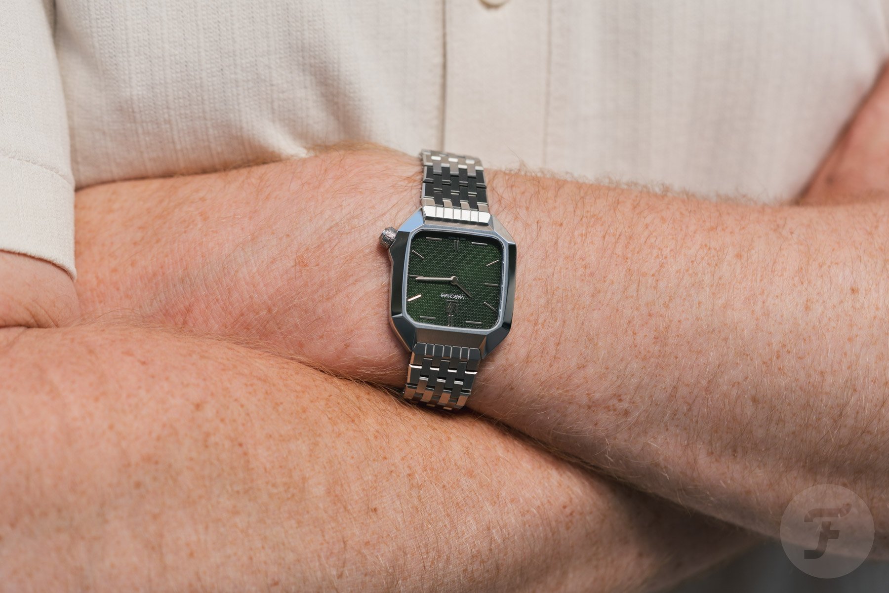March LA.B AM2 XS Grall on wrist, arms crossed