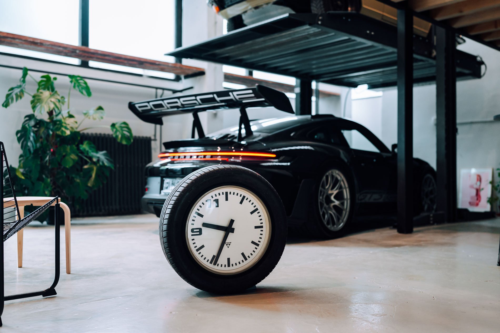 Pragotron UDC Coffee Timer clock in front of Porsche