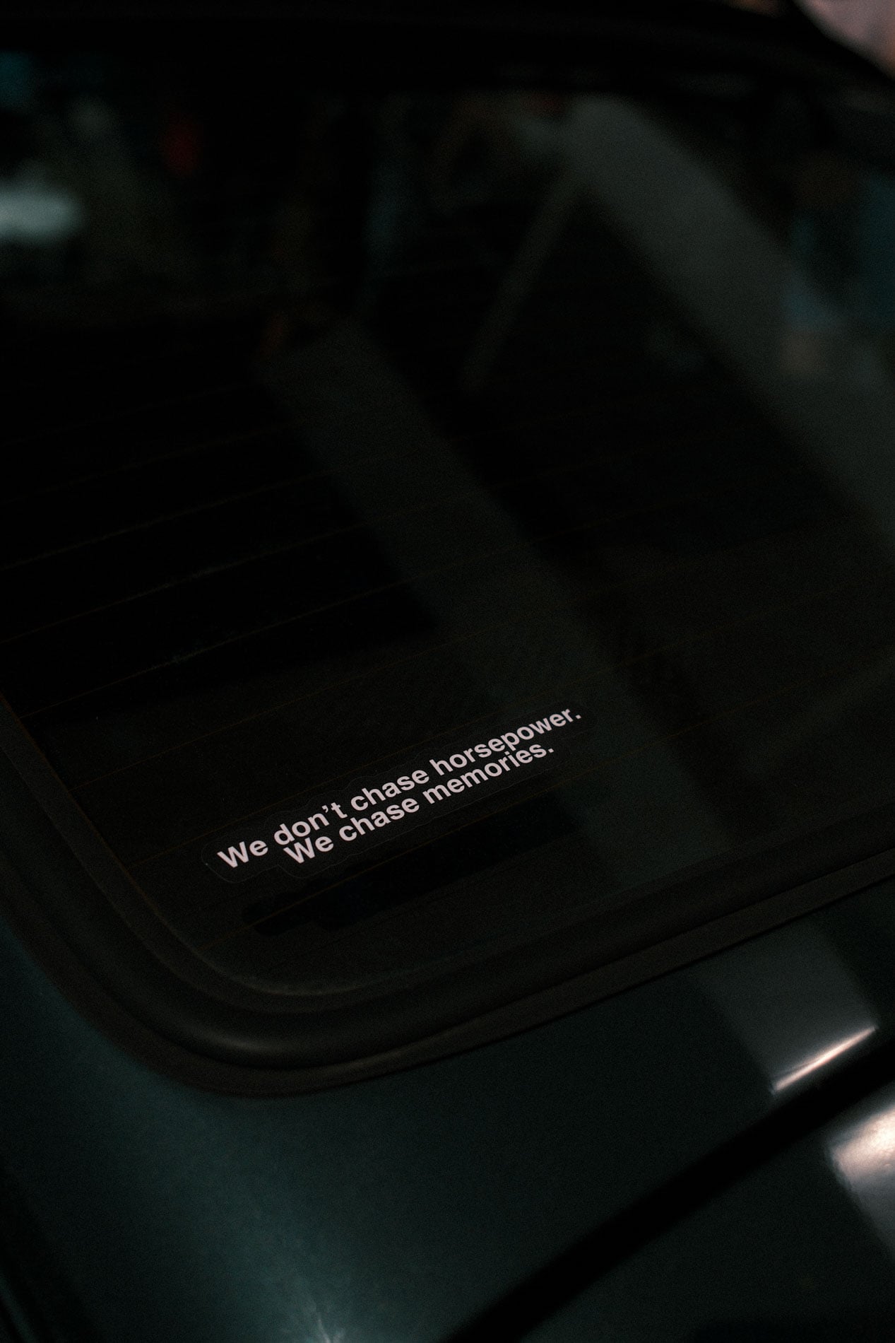 "We don't chase horsepower. We chase memories." sticker on car
