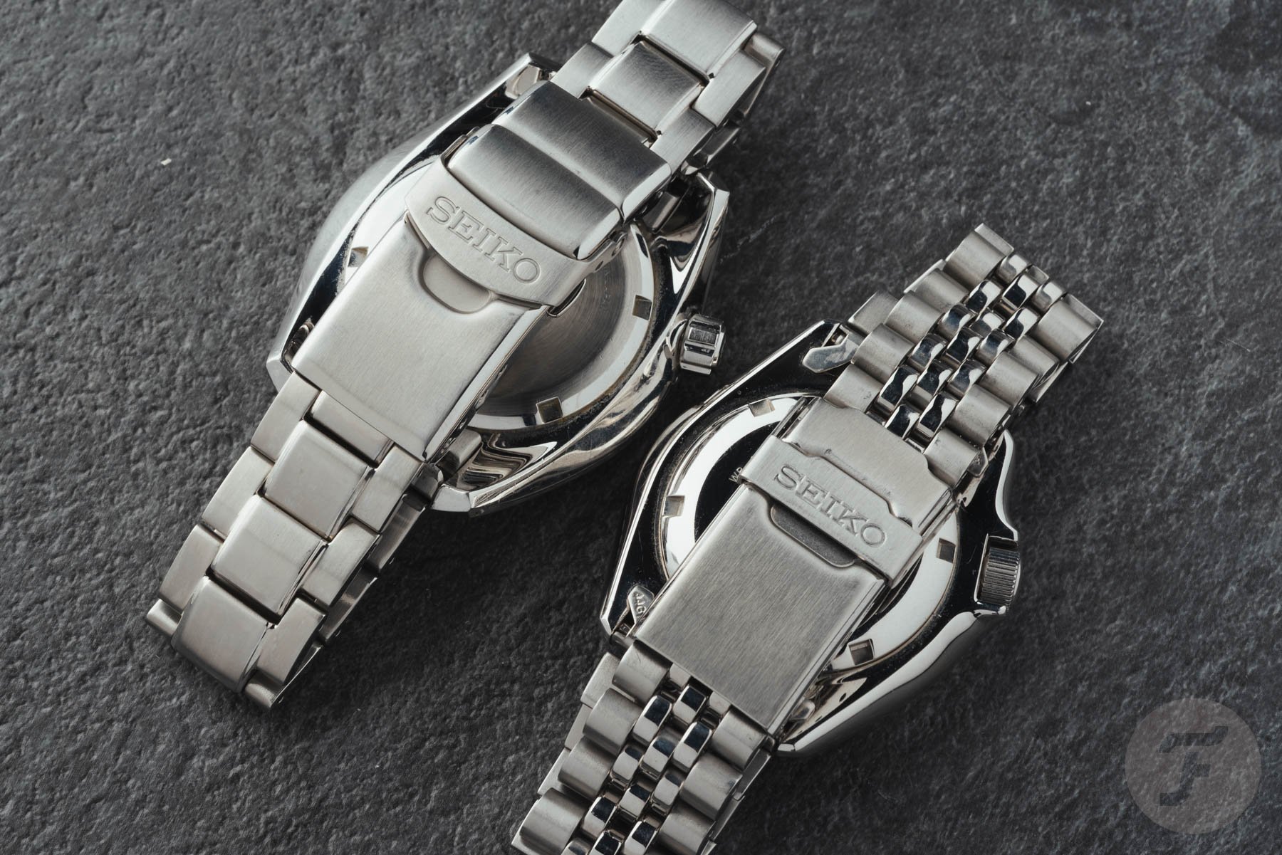 Seiko SKX007 and Sumo SBDC001 face down, clasps closed