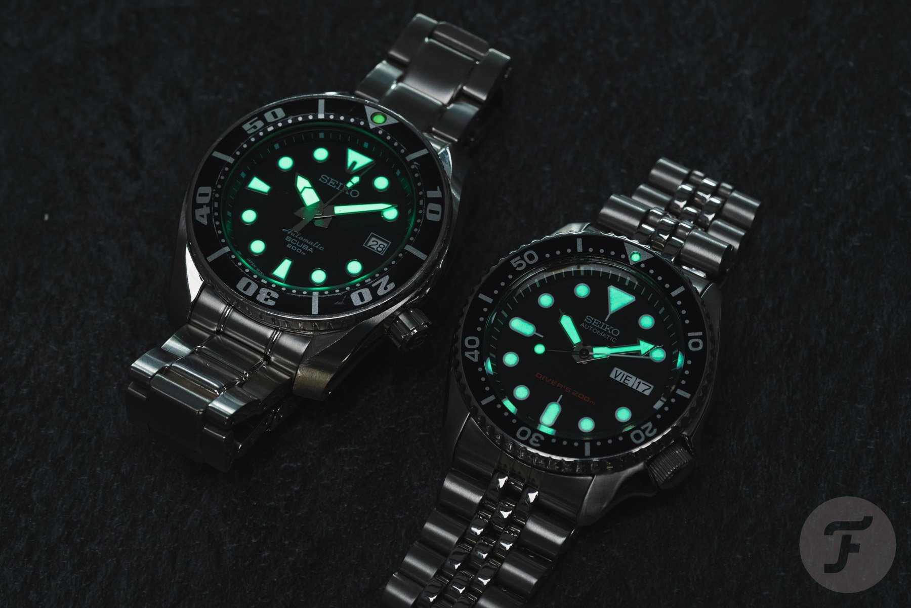 Seiko SKX007 and Sumo SBDC001 side by side, lume shot