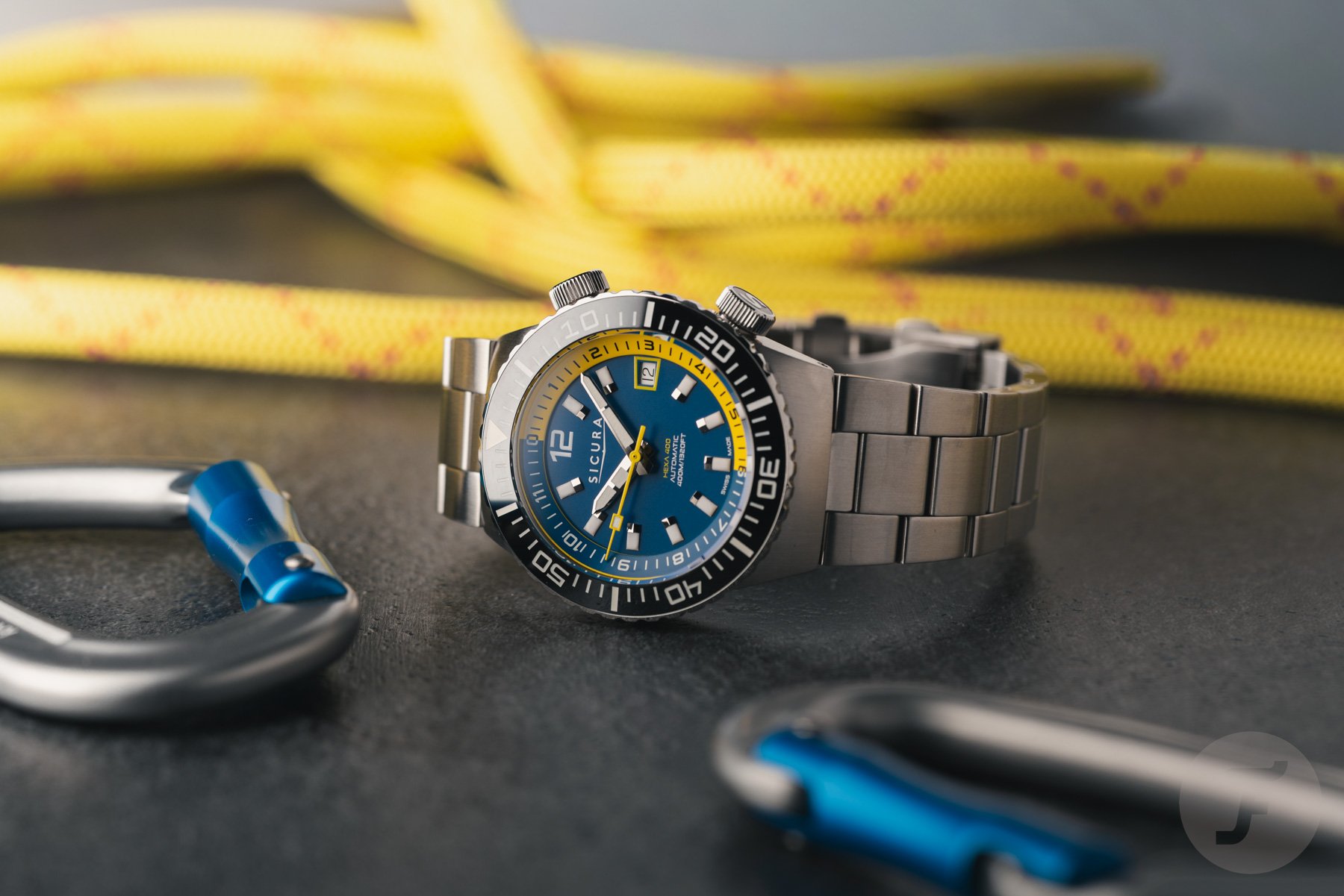 blue-dial Sicura Hexa 400 on its side, crowns up