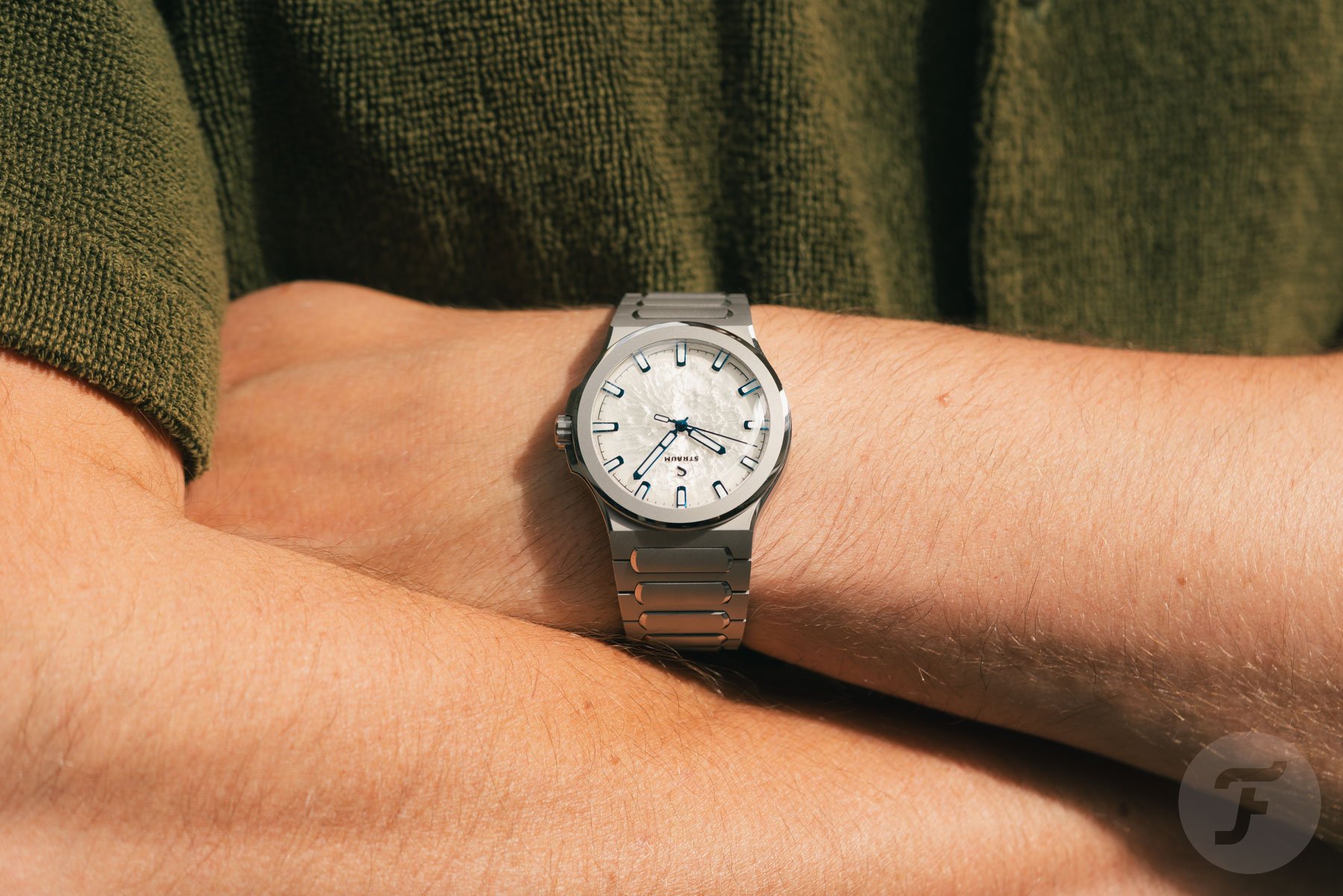 Straum Frozen Metal Titanium on wrist, arms crossed