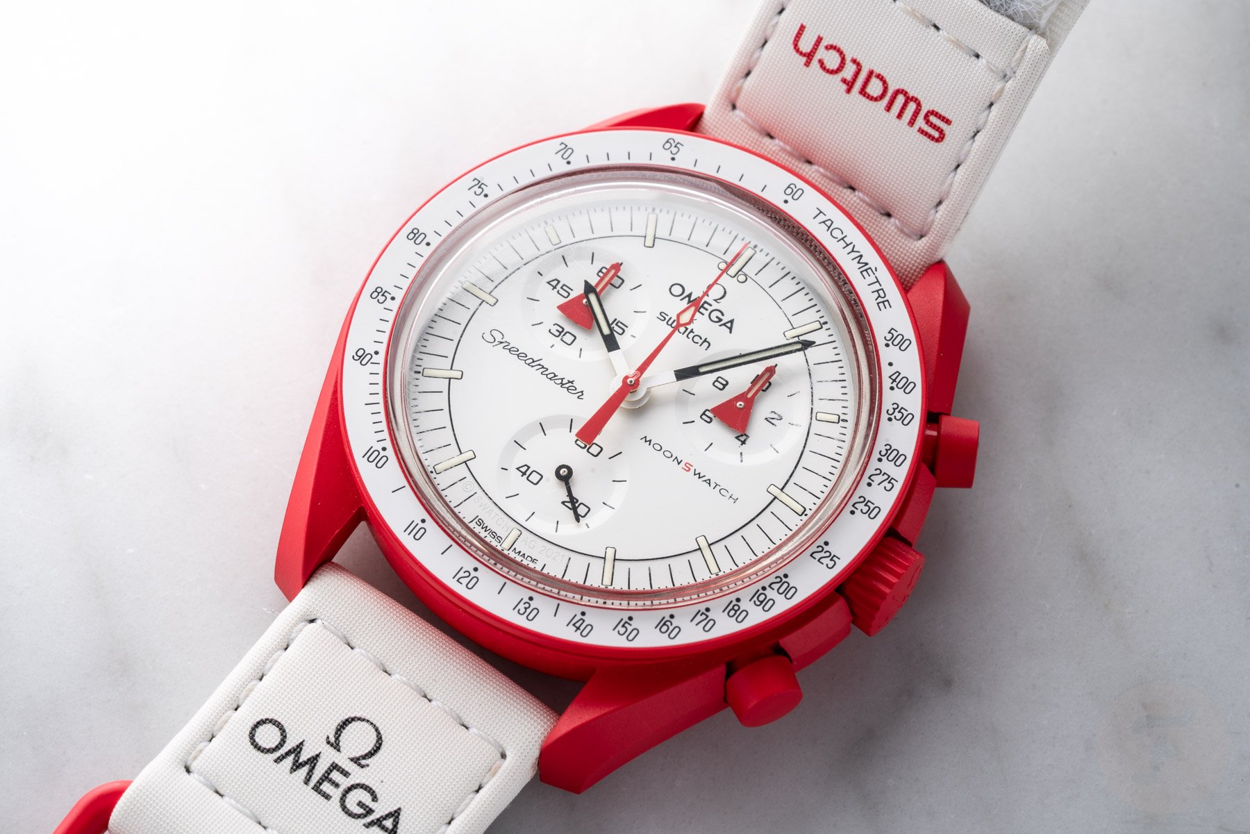 Omega × Swatch Speedmaster MoonSwatch Mission to Mars flat-lay, up close
