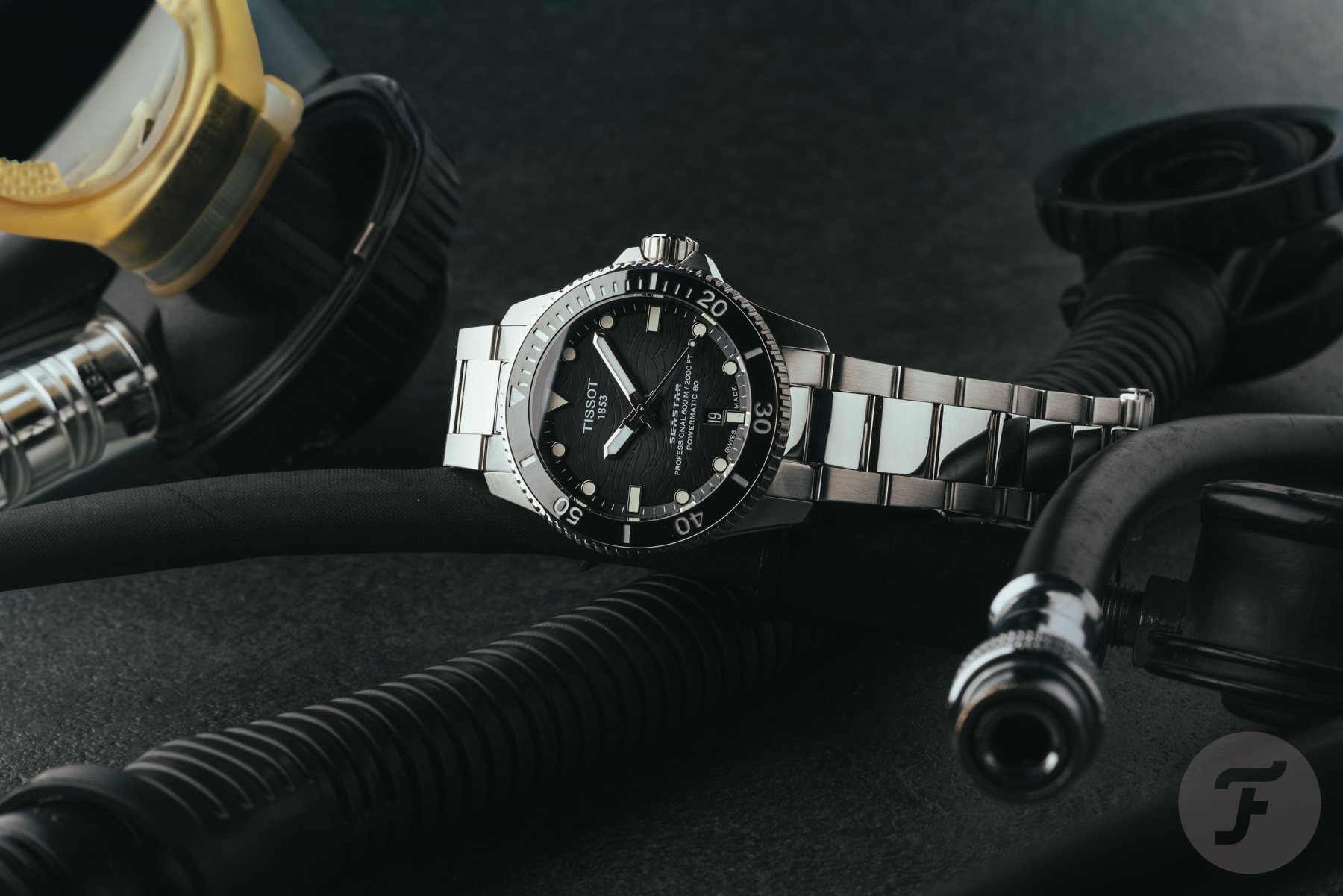gray-dial version of the sized-down Tissot Seastar 2000 Professional on its side, crown up