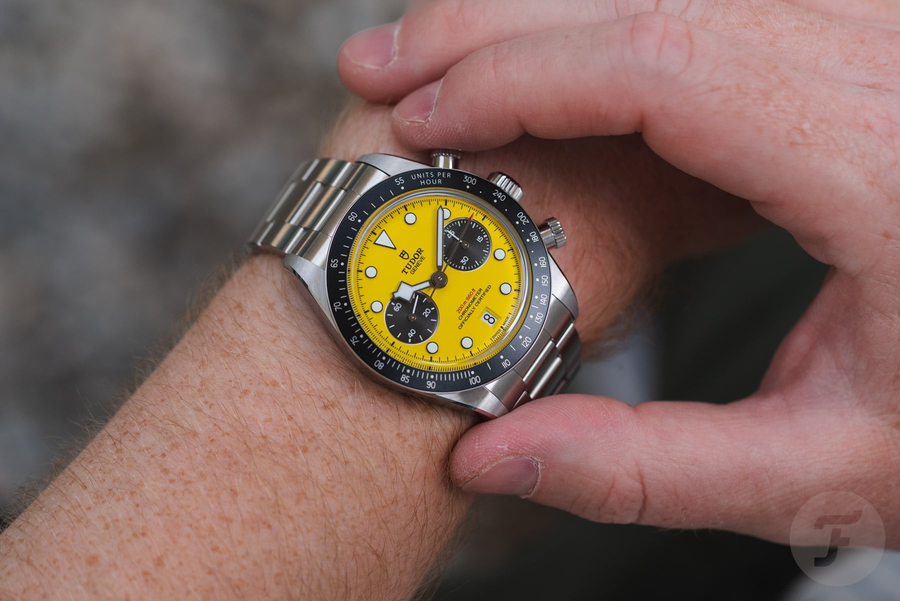Tudor Black Bay Chrono 39 Bumblebee on wrist, finger on pusher