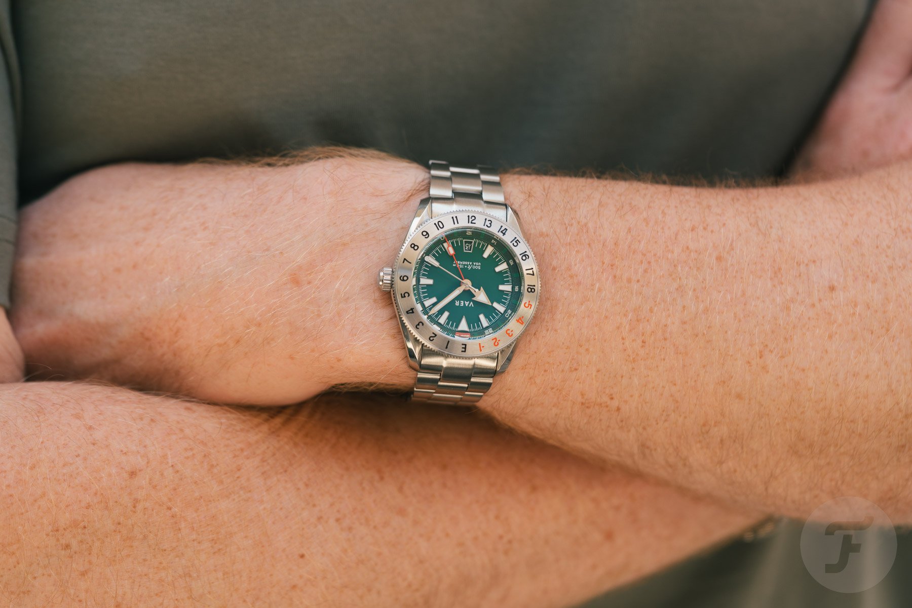 Vaer G2 Fairway GMT on wrist, arms crossed