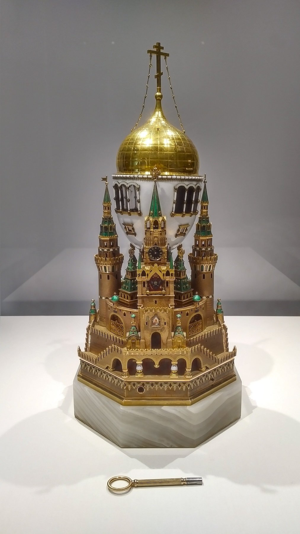 A Carl Fabergé Easter egg (1906) modeled after Dormition Cathedral and towers of Moscow Kremlin, featuring clock and music box hidden inside