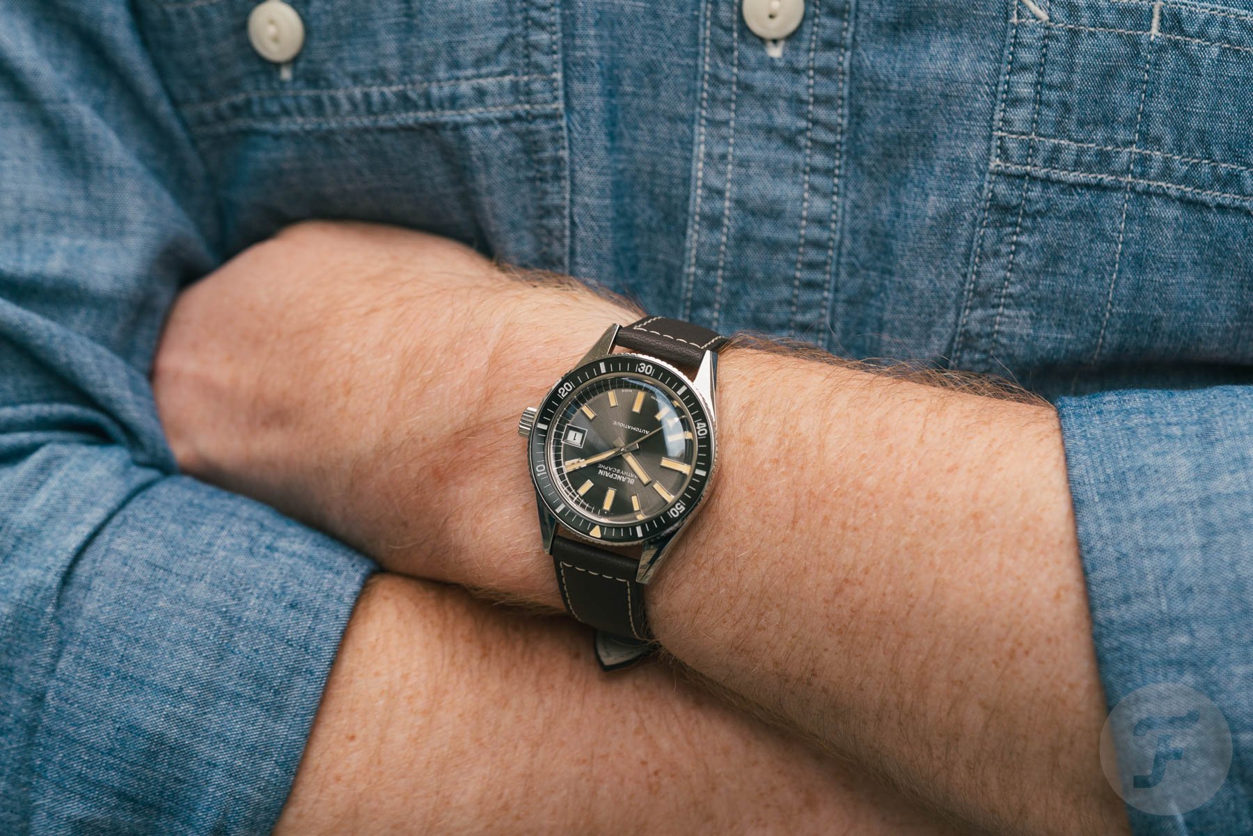 Blancpain Fifty Fathoms Bathyscaphe 70th Anniversary on wrist, arms crossed