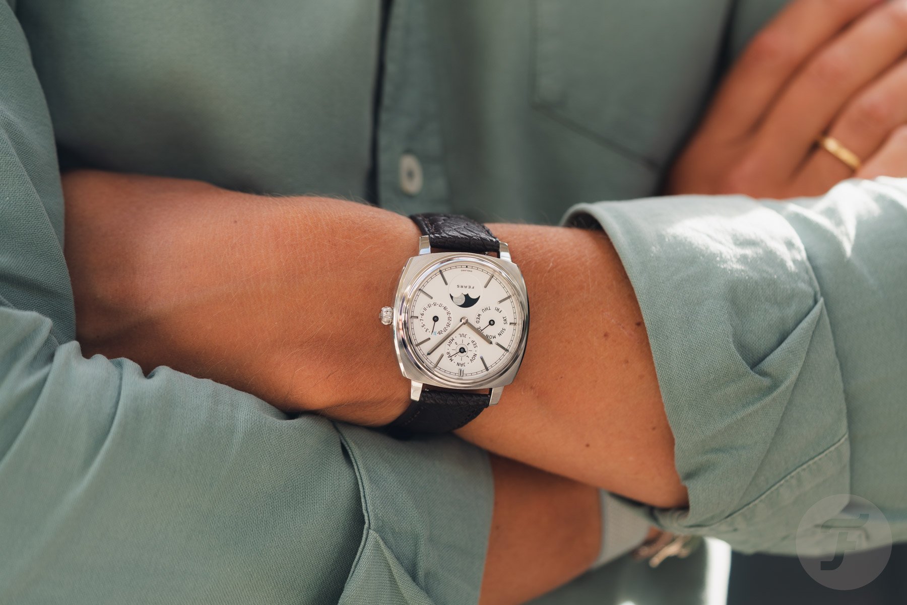Fears Brunswick 39 Perpetual Calendar on wrist, arms crossed