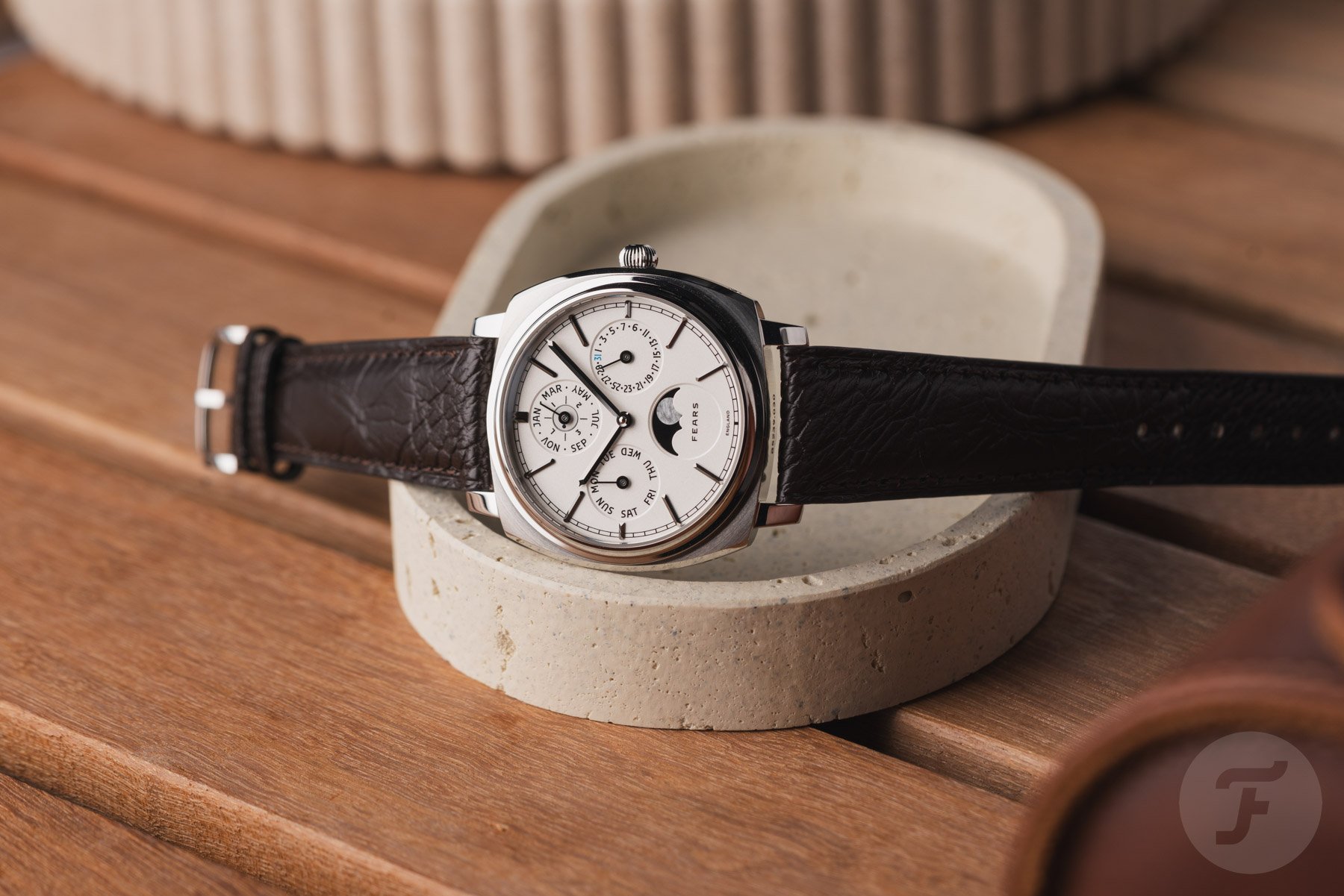 Fears Brunswick 39 Perpetual Calendar on its side, crown up on edge of tray