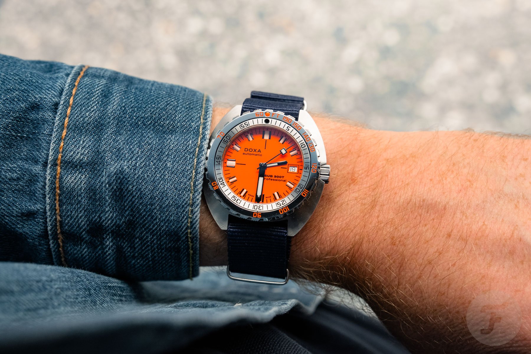 Doxa Sub 300T on blue NATO strap, wrist shot