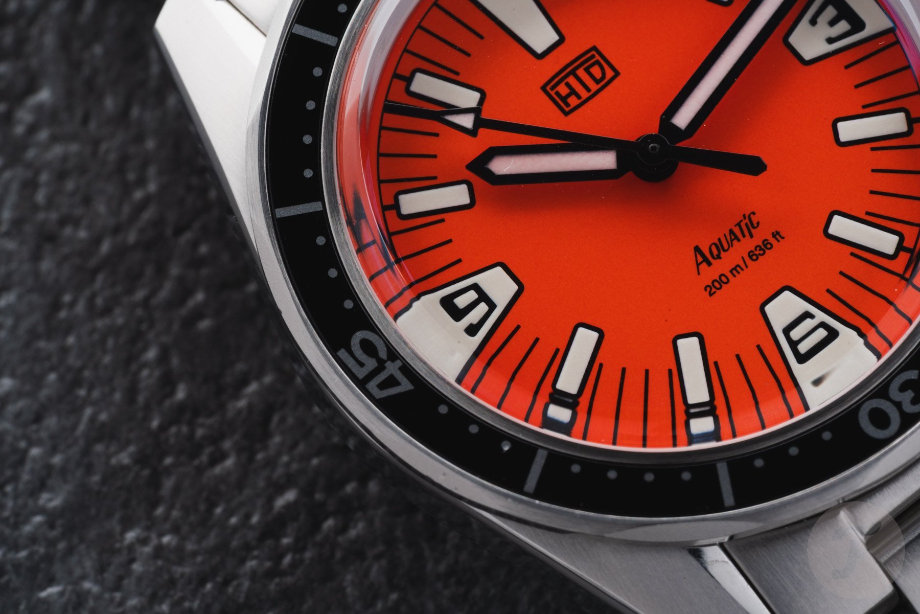 orange-dial HTD Aquatìc SpaceBoy dial and bezel detail