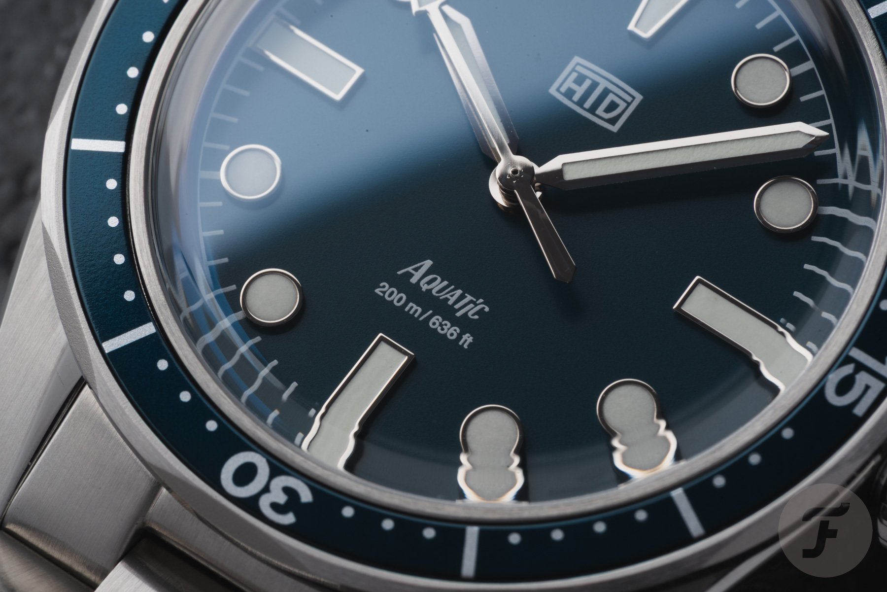 blue-dial HTD Aquatìc Bicchierini indexes up close