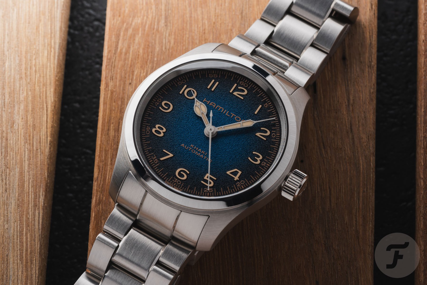 close-up flat-lay of blue-dial Hamilton Khaki Field Murph 38mm