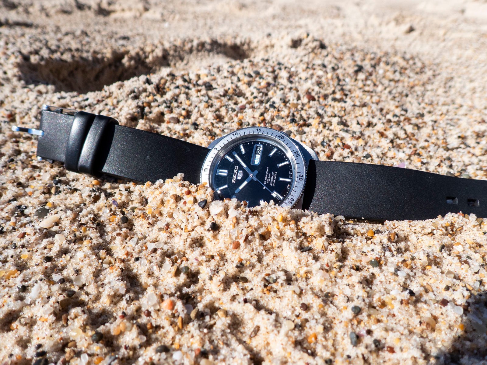 Seiko 5 "Gene Kranz" SRPL93 in sand on beach