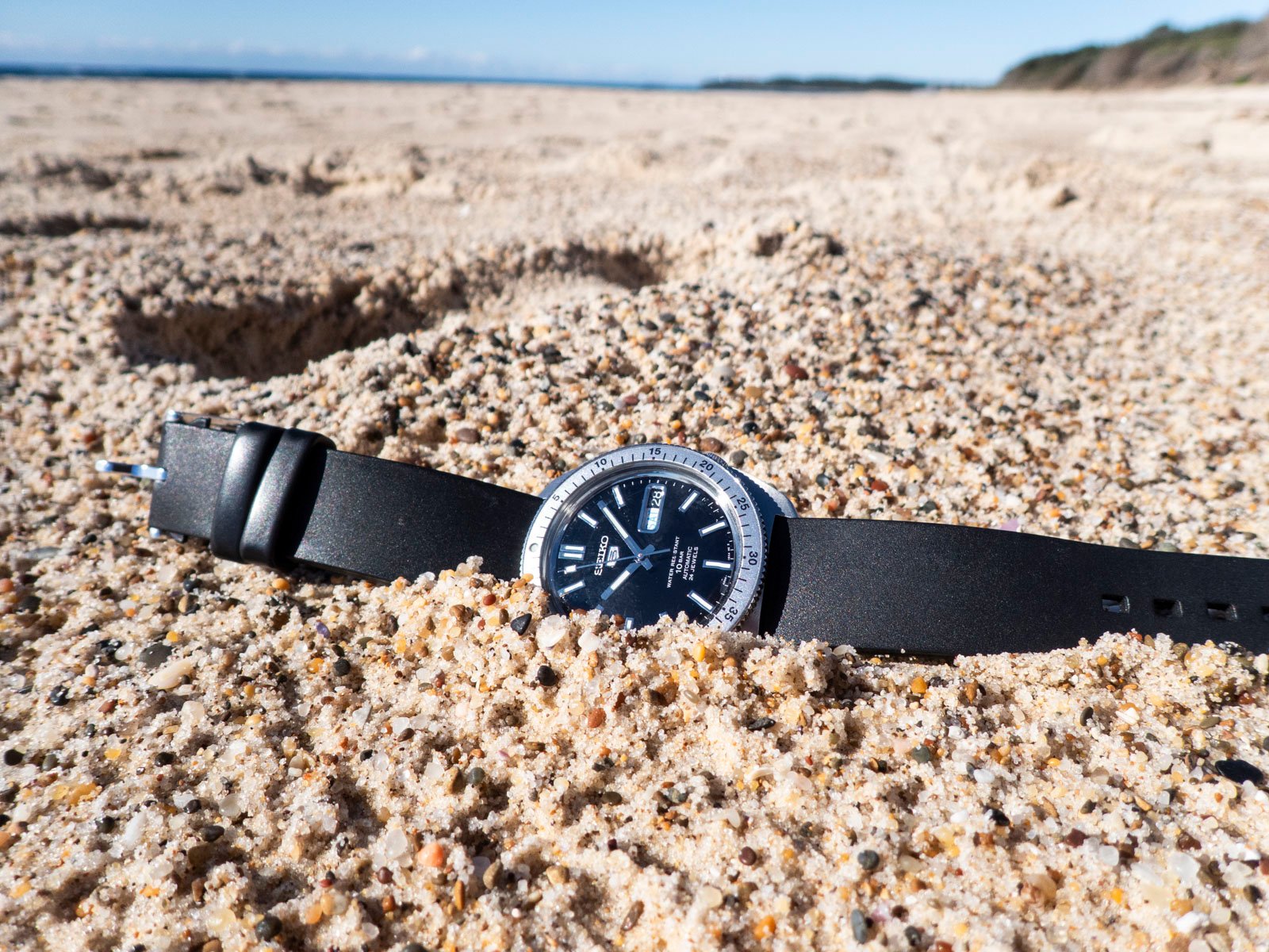 Seiko 5 "Gene Kranz" SRPL93 in sand on beach