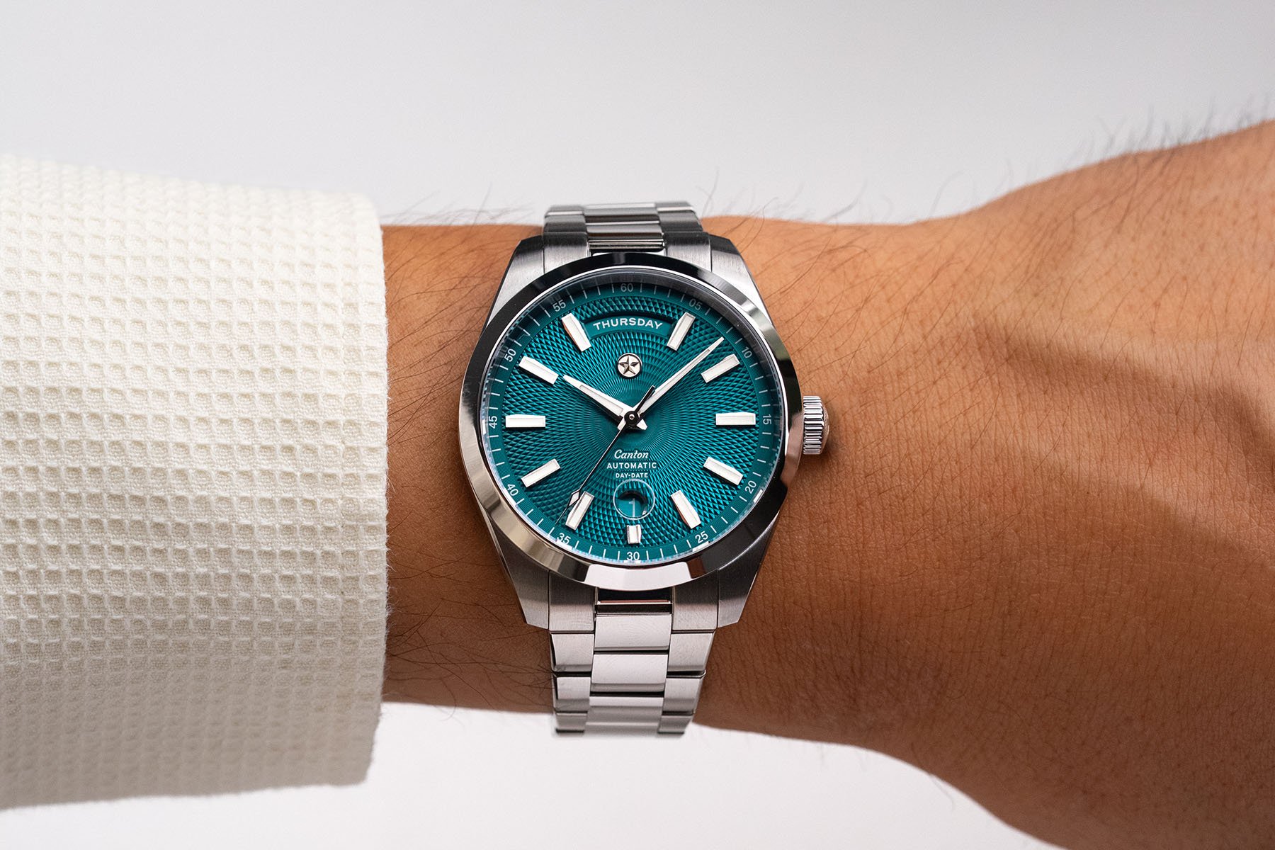 Lagoon-dial Jack Mason Canton Day-Date wrist shot