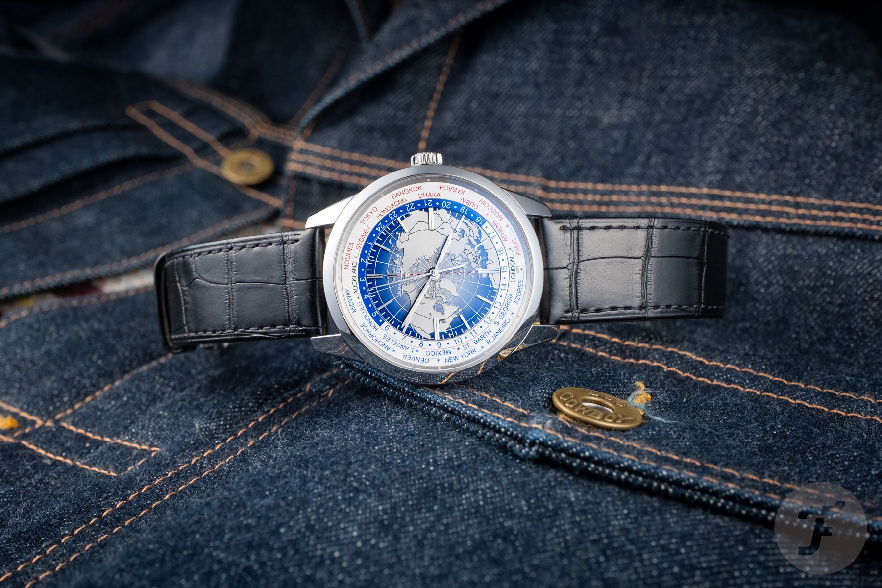 Jaeger-LeCoultre Geophysic Universal Time lying on a Lee 101 denim jacket