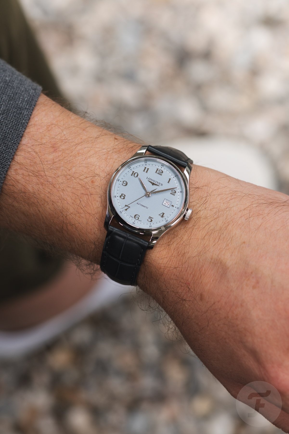 blue-dial Longines Master 41 on wrist