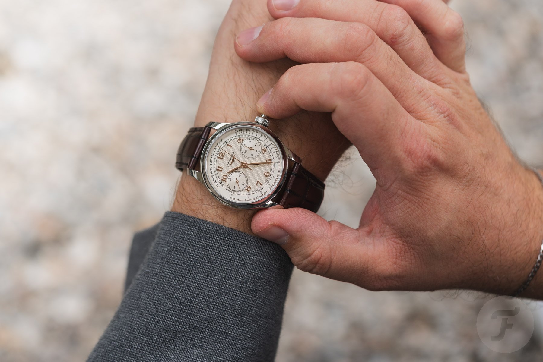 Longines Master Chrono Monopusher on wrist, finger on pusher