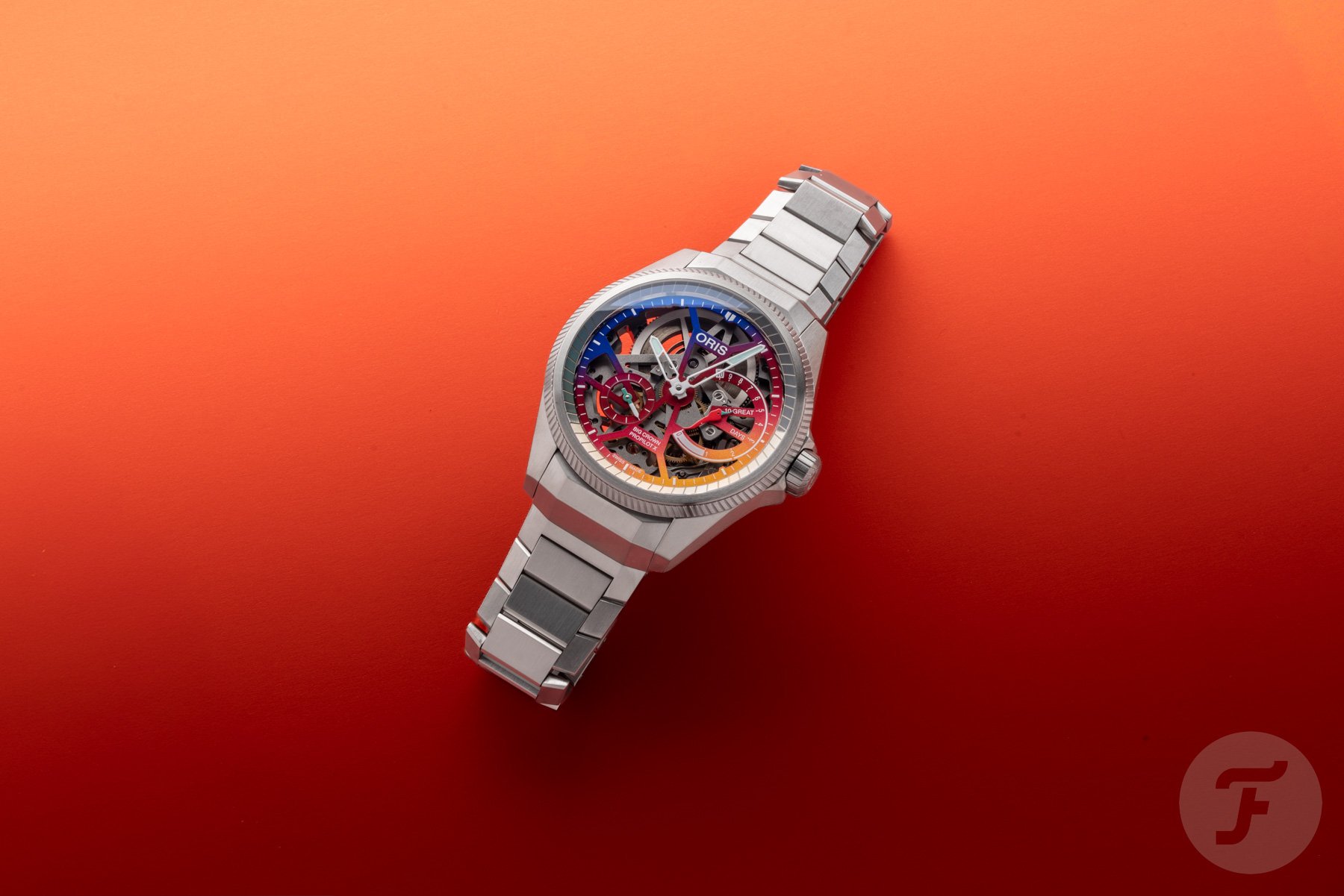 flat-lay of the Oris ProPilot X Gonzo Edition on an orange background