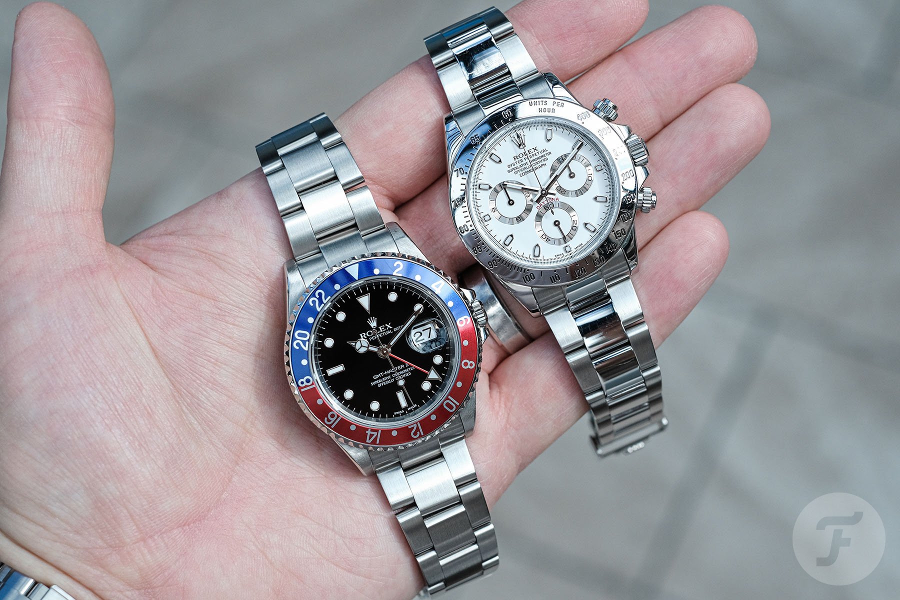Ben's Rolex GMT-Master II 16710 and Cosmograph Daytona 116520 in hand