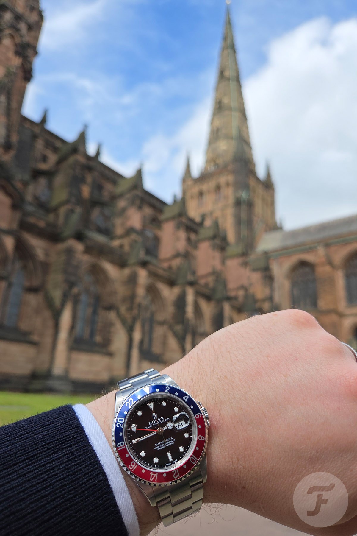Rolex GMT-Master II 16710 on wrist in front of cathedral