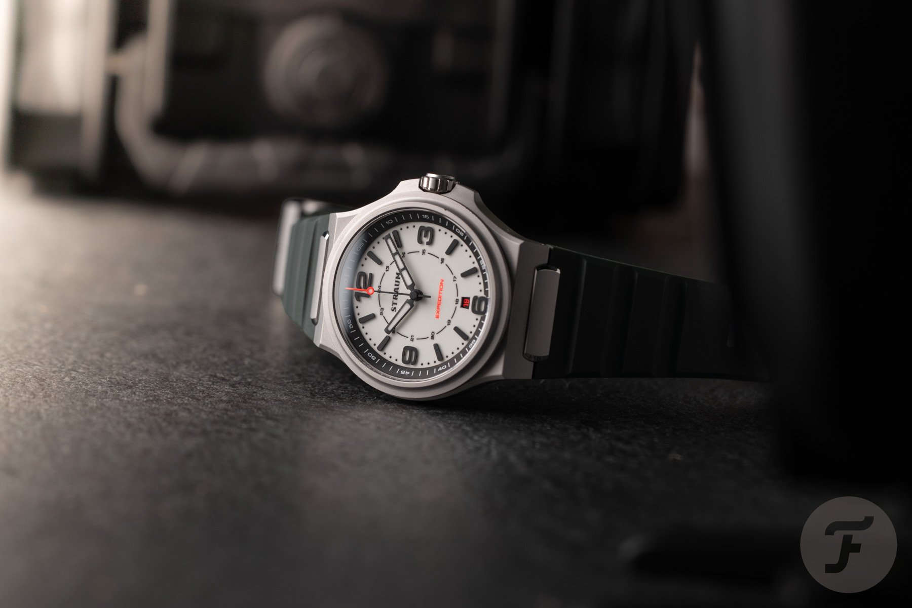 lume-dial Straum Expedition on it side, crown up