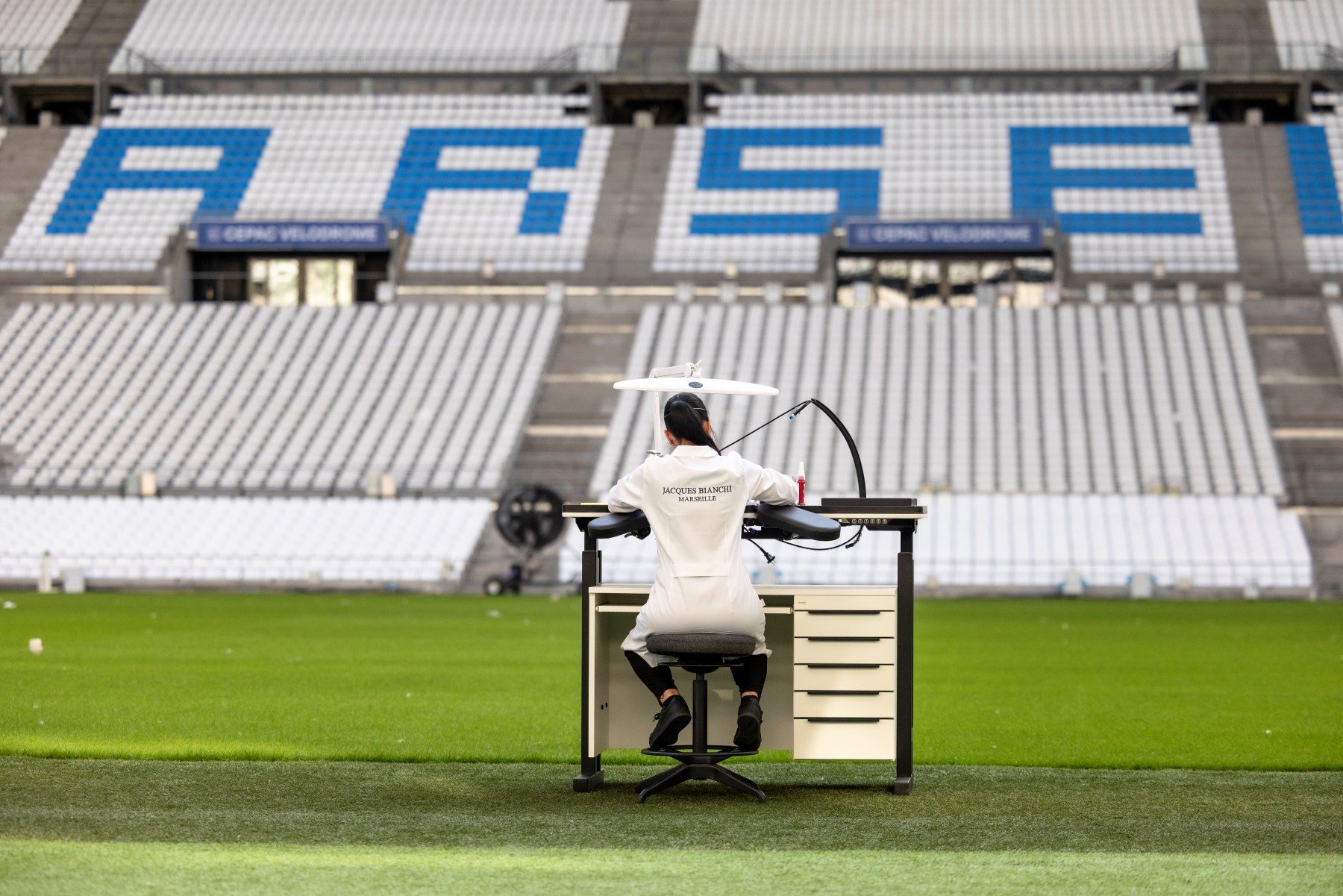Jacques Bianchi Marseille watchmaker working on the pitch of the Stade Vélodrome
