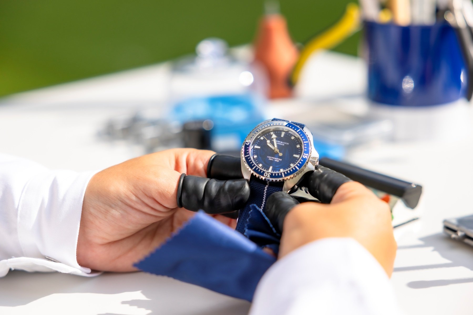 Watchmaker holding the Olympique de Marseille × Jacques Bianchi Marseille JB200 Chronometer