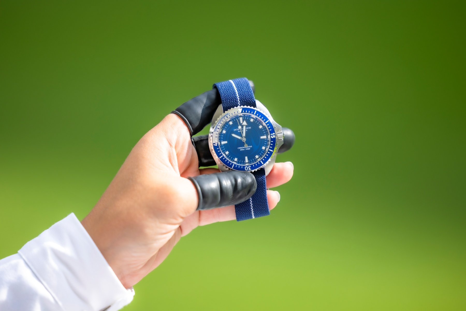 Watchmaker holding the Olympique de Marseille × Jacques Bianchi Marseille JB200 Chronometer