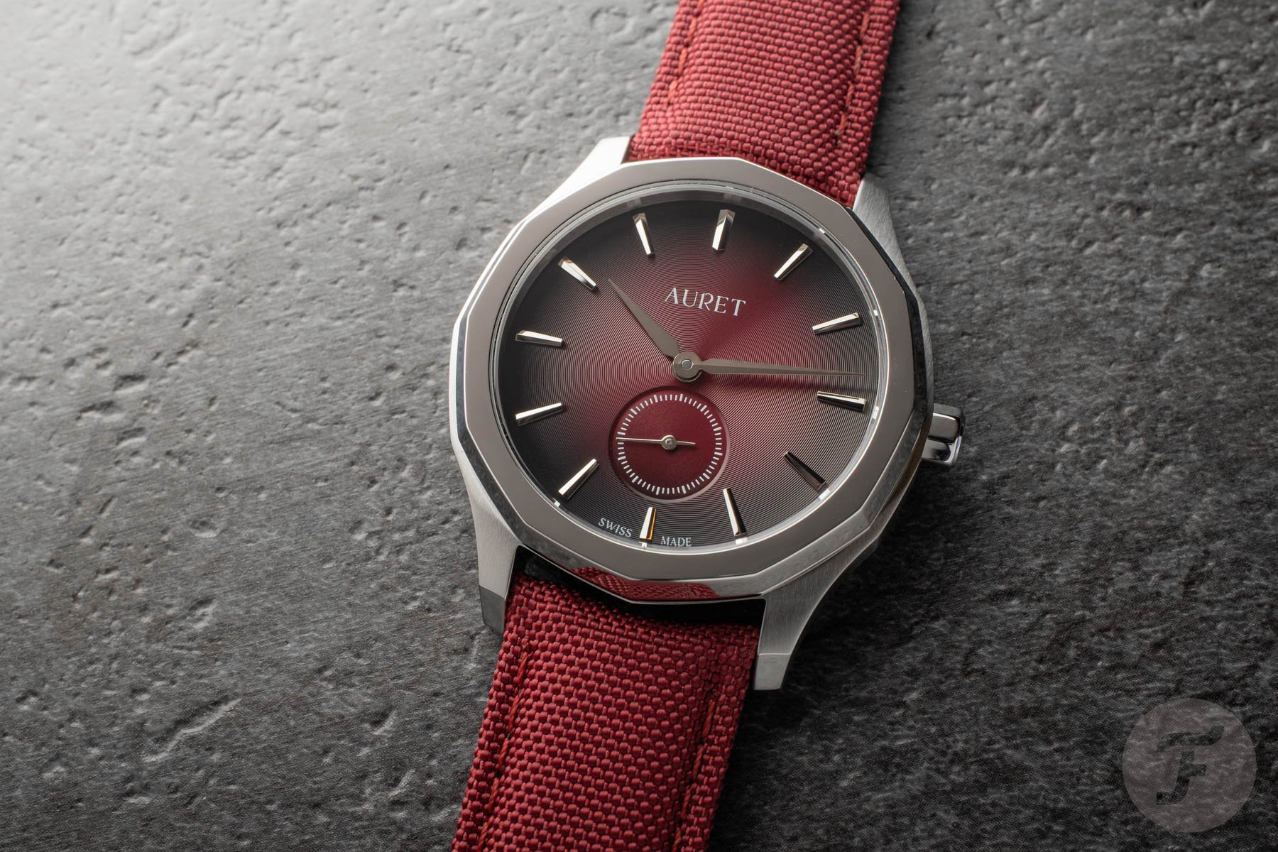 burgundy-dial Auret Mederi flat-lay