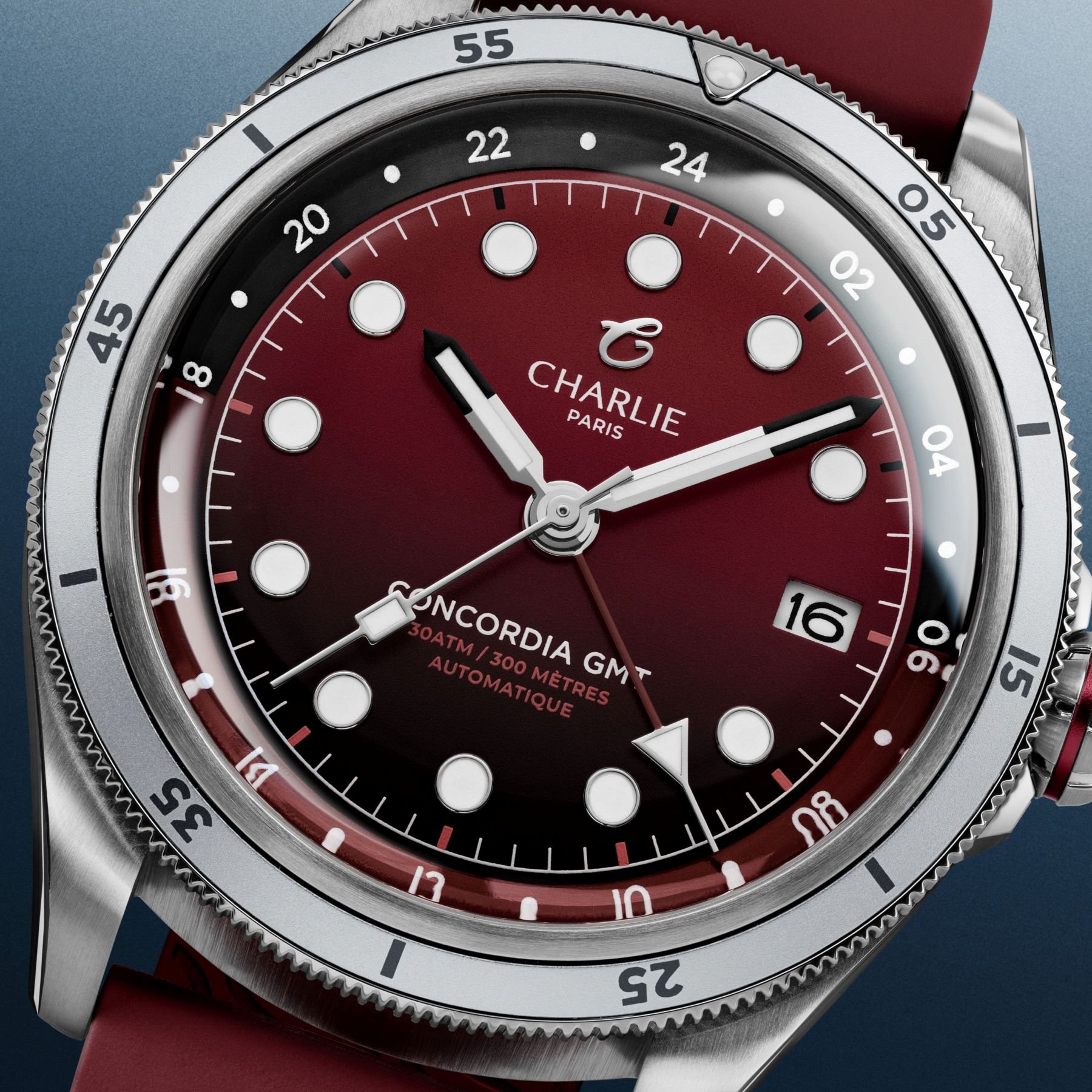 Dial close-up of the Charlie Concordia GMT Burgundy