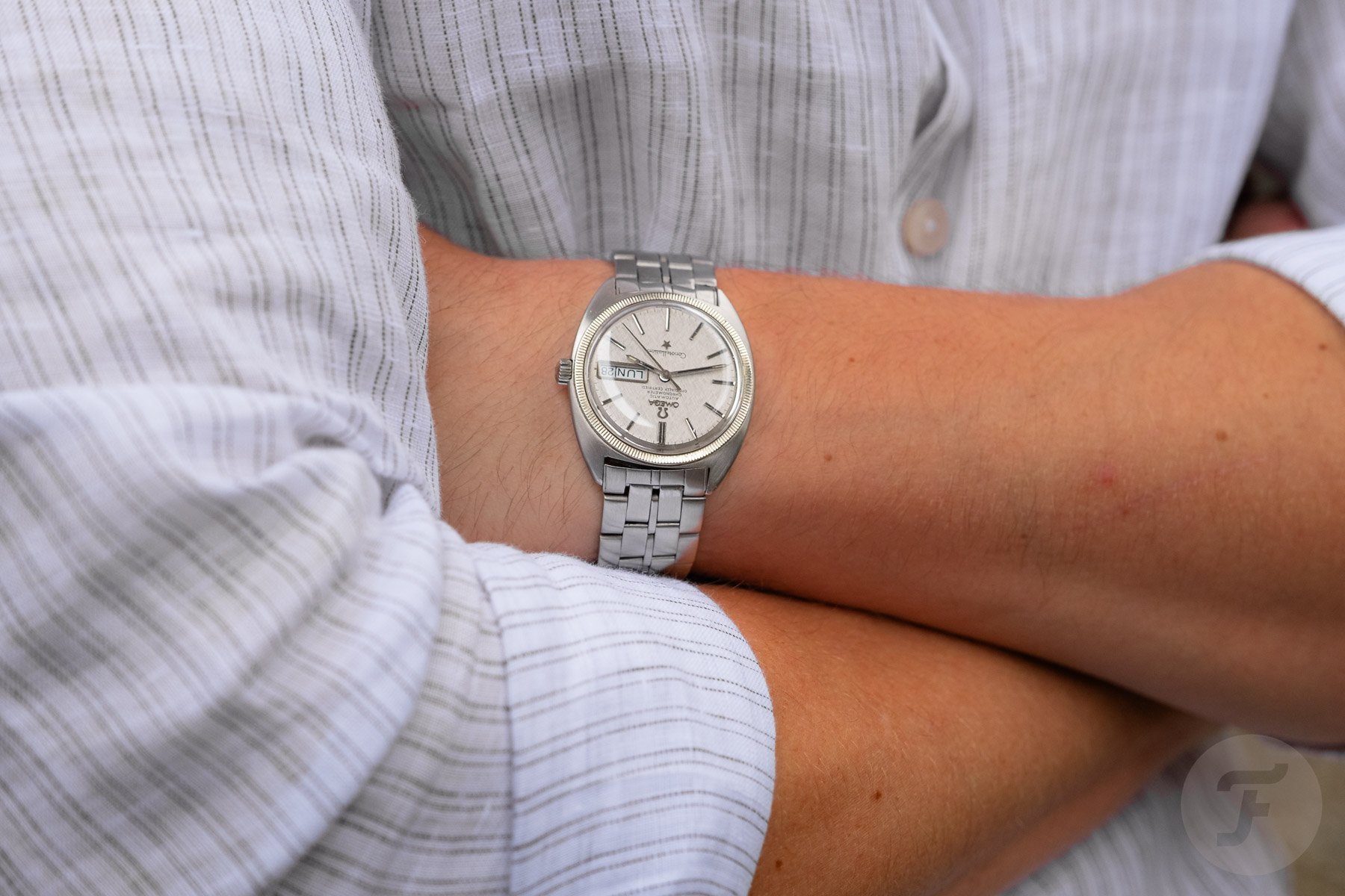 Omega Constellation ref. 168.029 on wrist, arms crossed