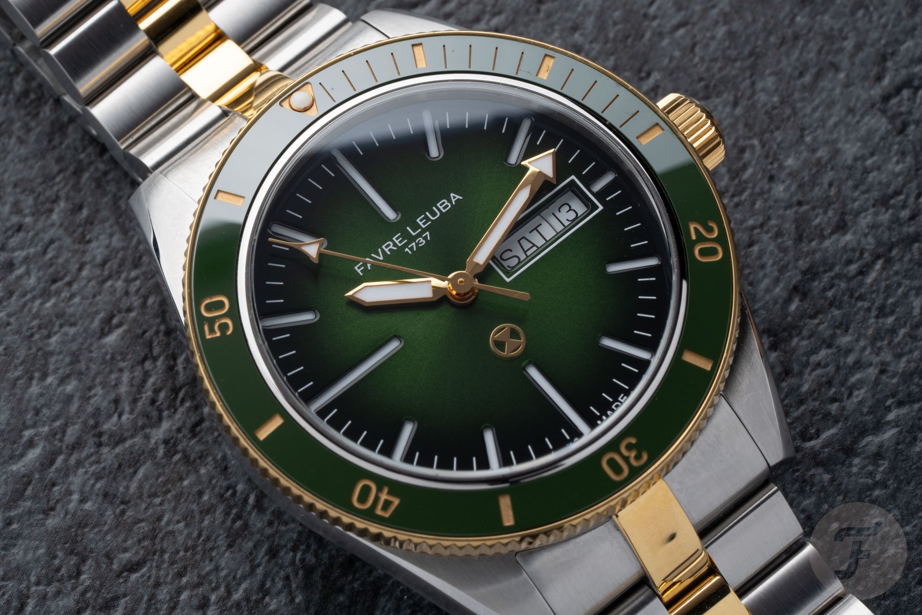 green-dial two-tone Favre Leuba Deep Raider Day Date flat-lay, up close