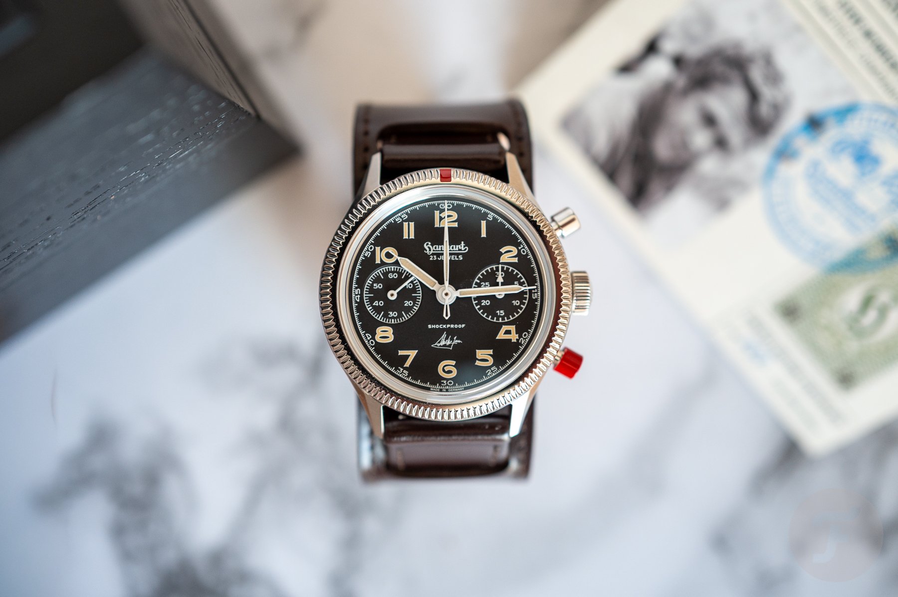 Hanhart 417 ES Steve McQueen Limited Edition No. 1 head on between box and LE card
