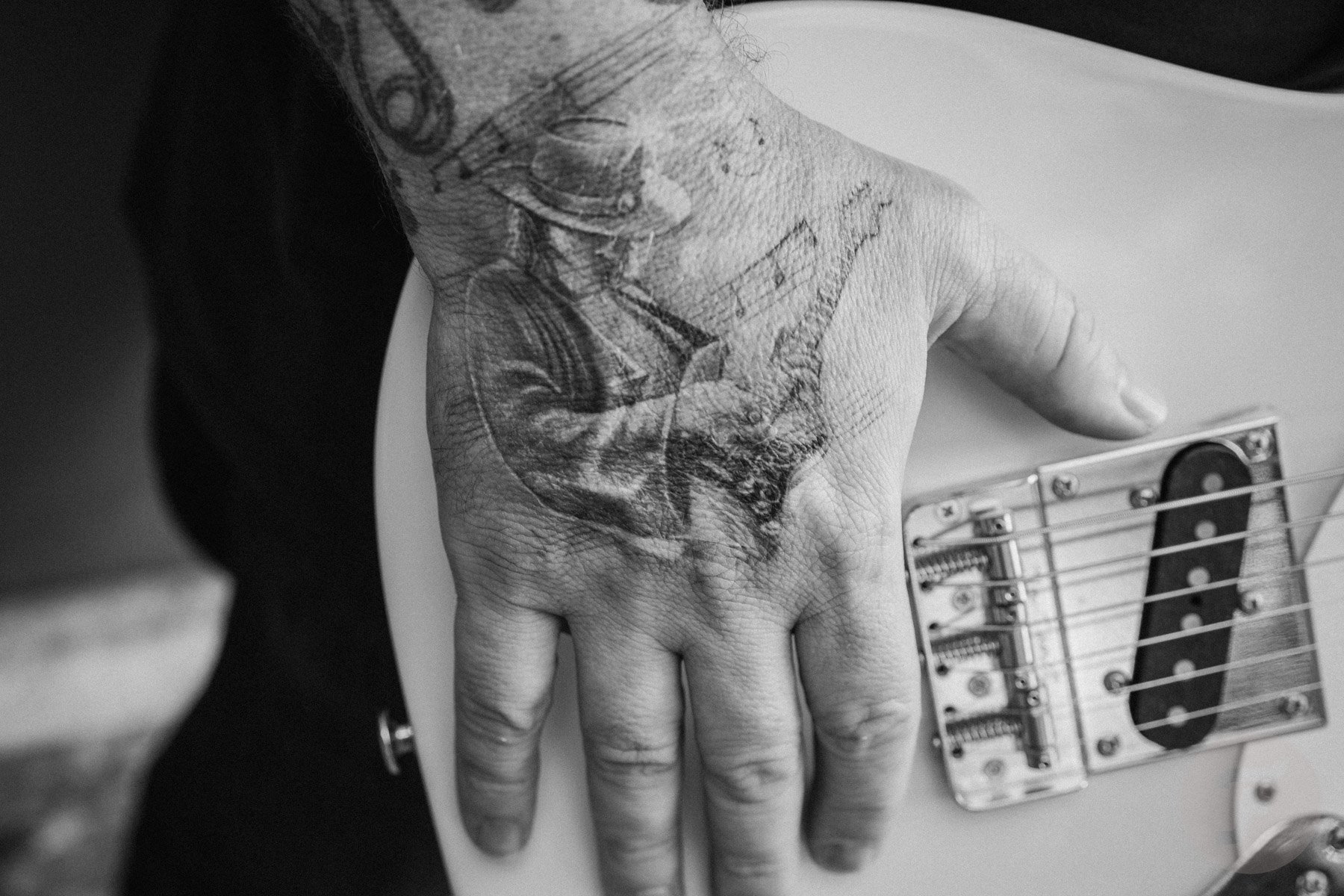 Tattoo of Stevie Ray Vaughan on the right hand of guitarist Josh Smith