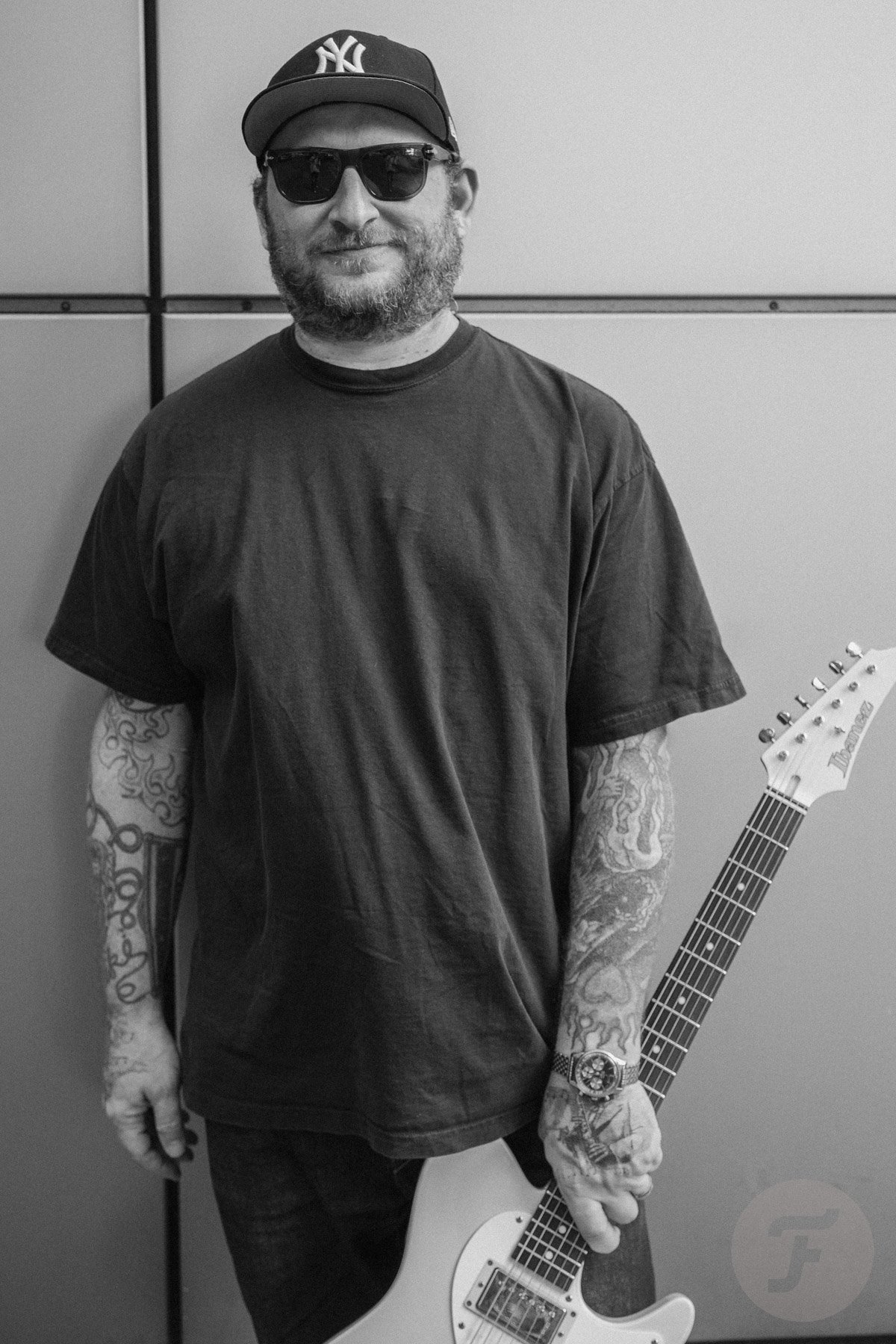 Guitarist Josh Smith with his signature Ibanez guitar and an Enicar Sharpa Graph on the wrist