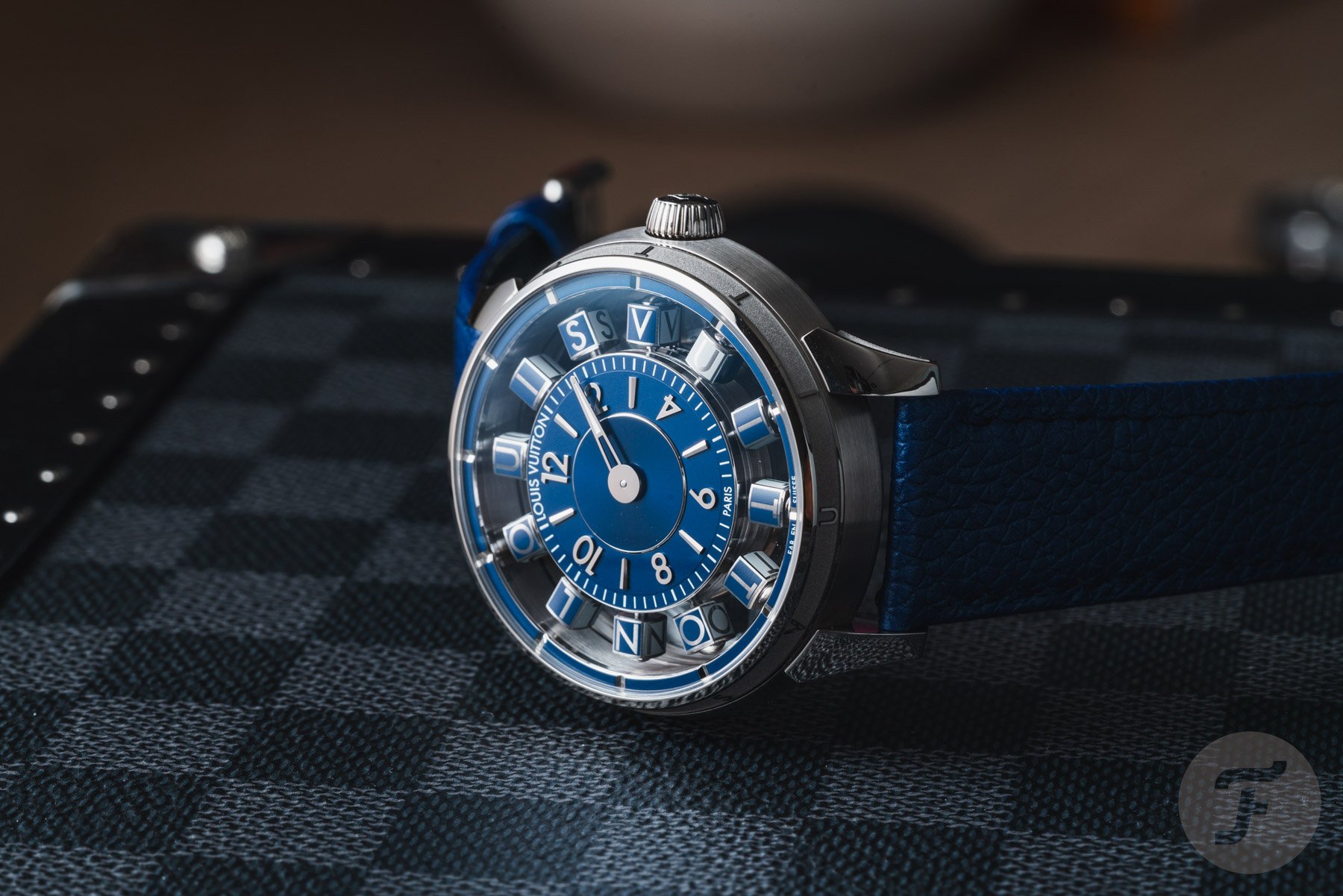 Louis Vuitton Tambour Spin Time Air Blue on its side, crown up
