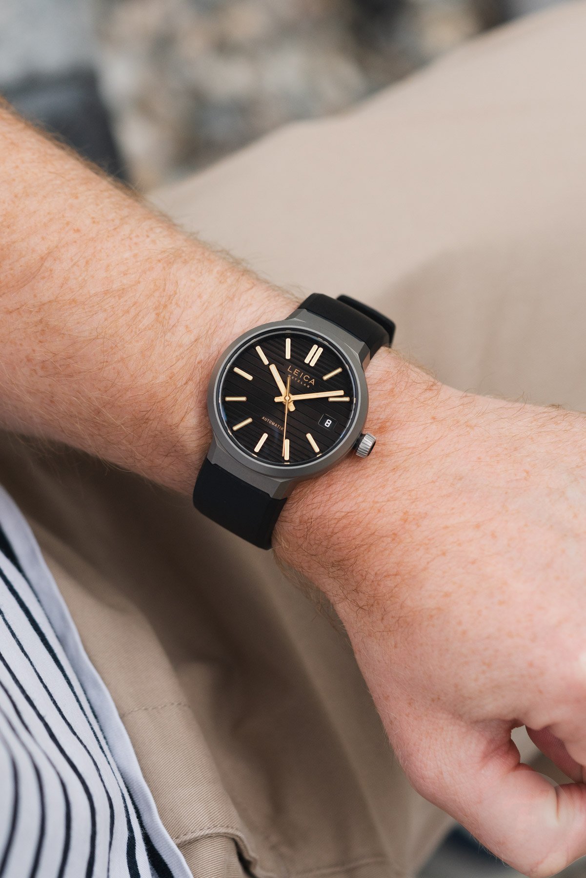 Leica ZM 11 Titanium Coffee Black with rubber strap, wrist shot