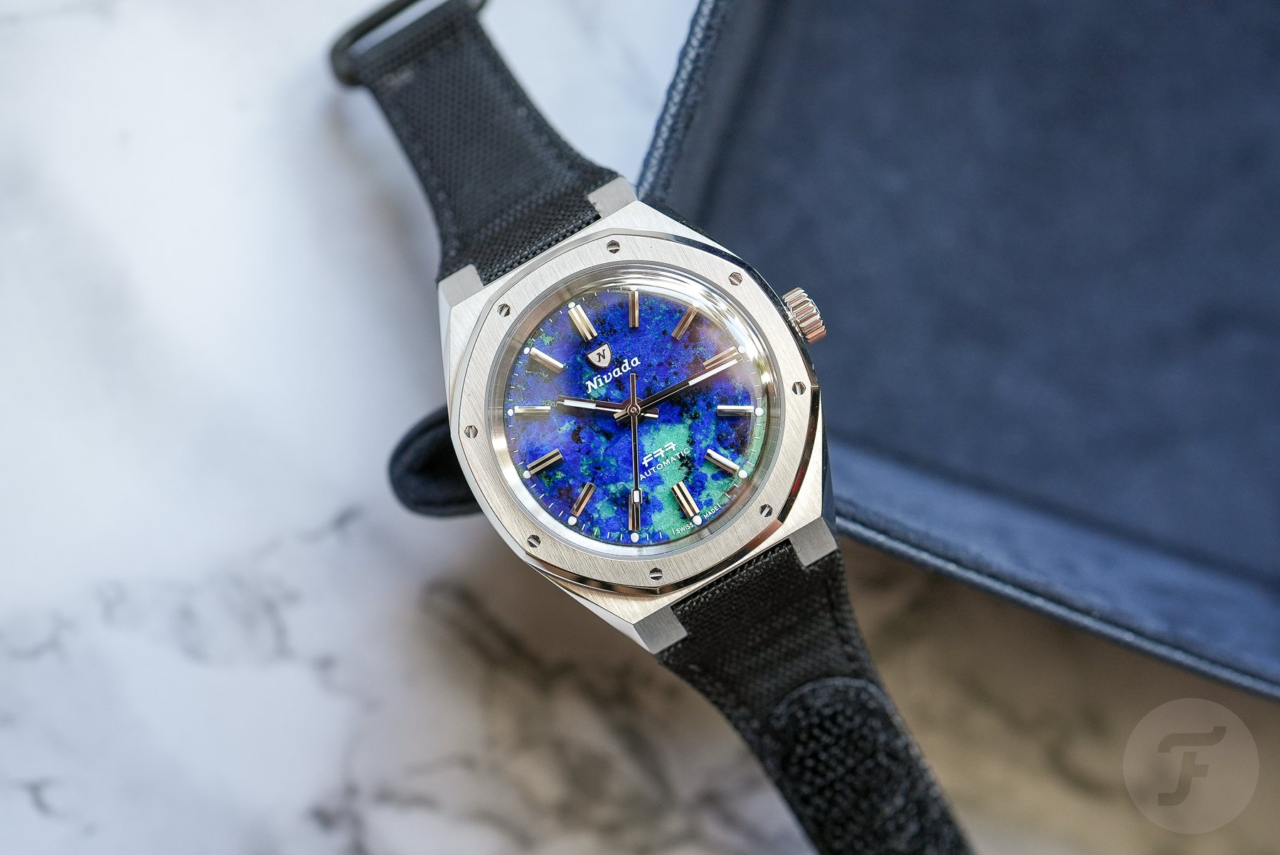 Nivada Grenchen F77 MKII Azurite on edge of tray