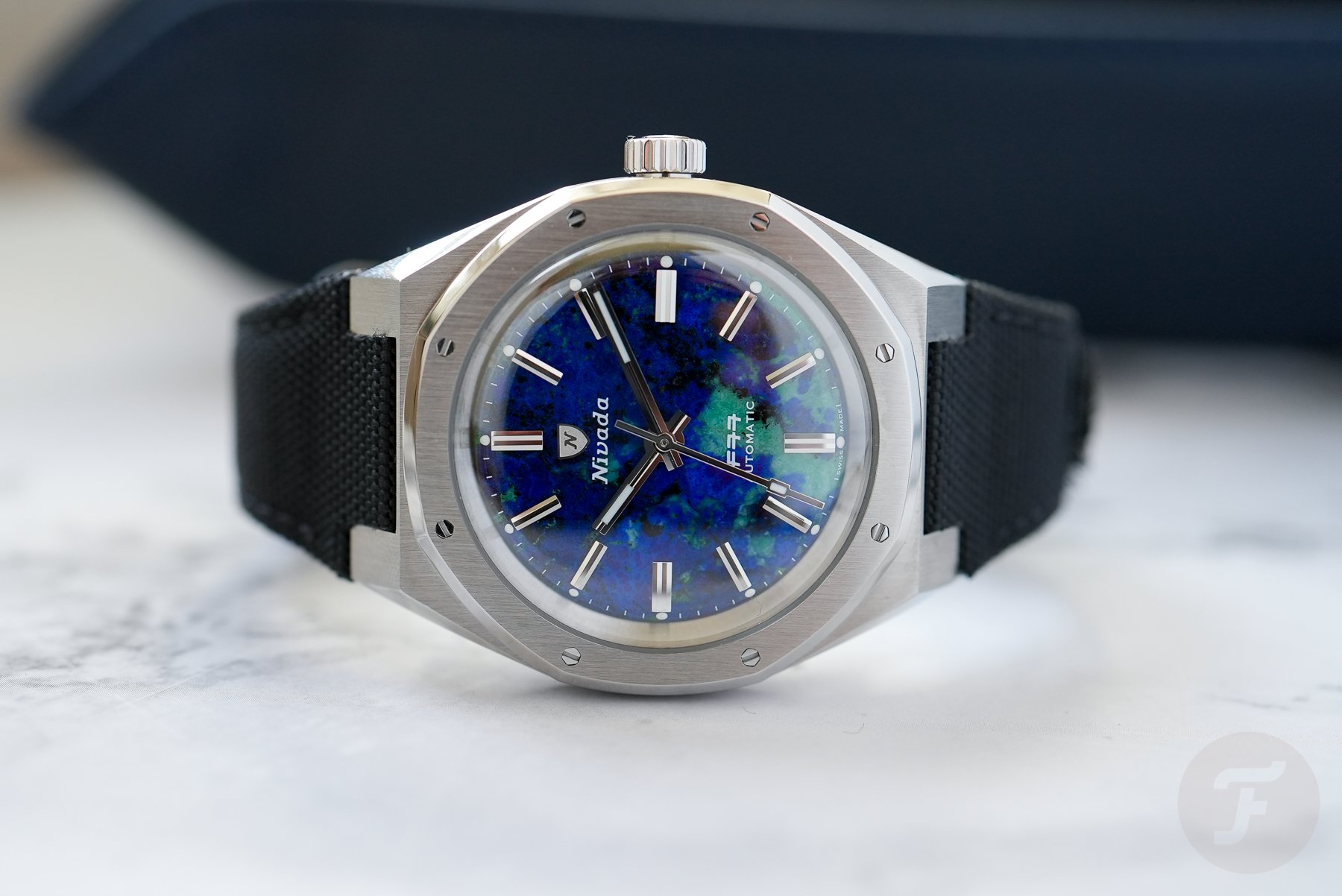 Nivada Grenchen F77 MKII Azurite on its side, crown up