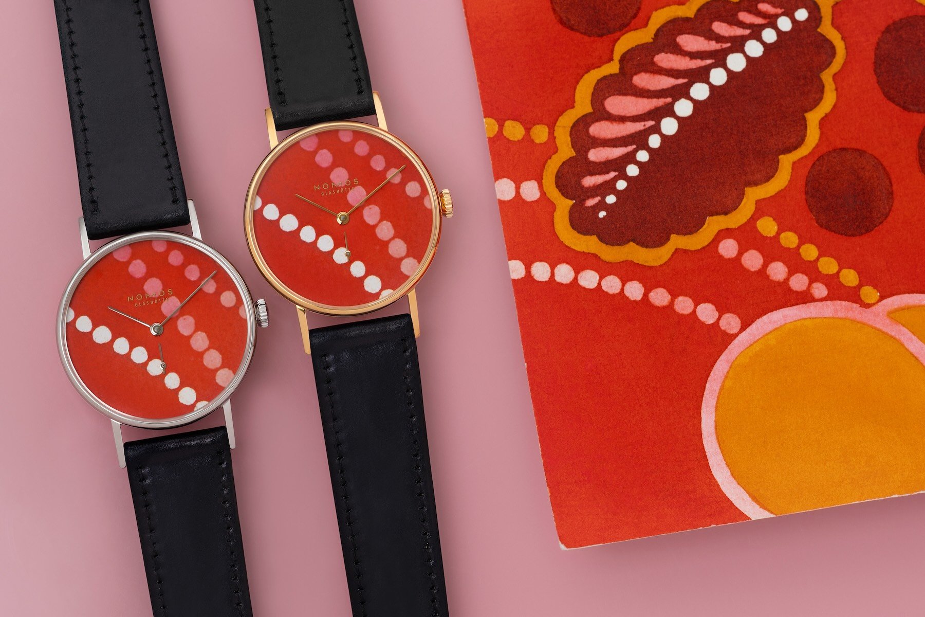 Nomos Twice Unique Ludwig Rive Gauche watches side by side, flat-lay