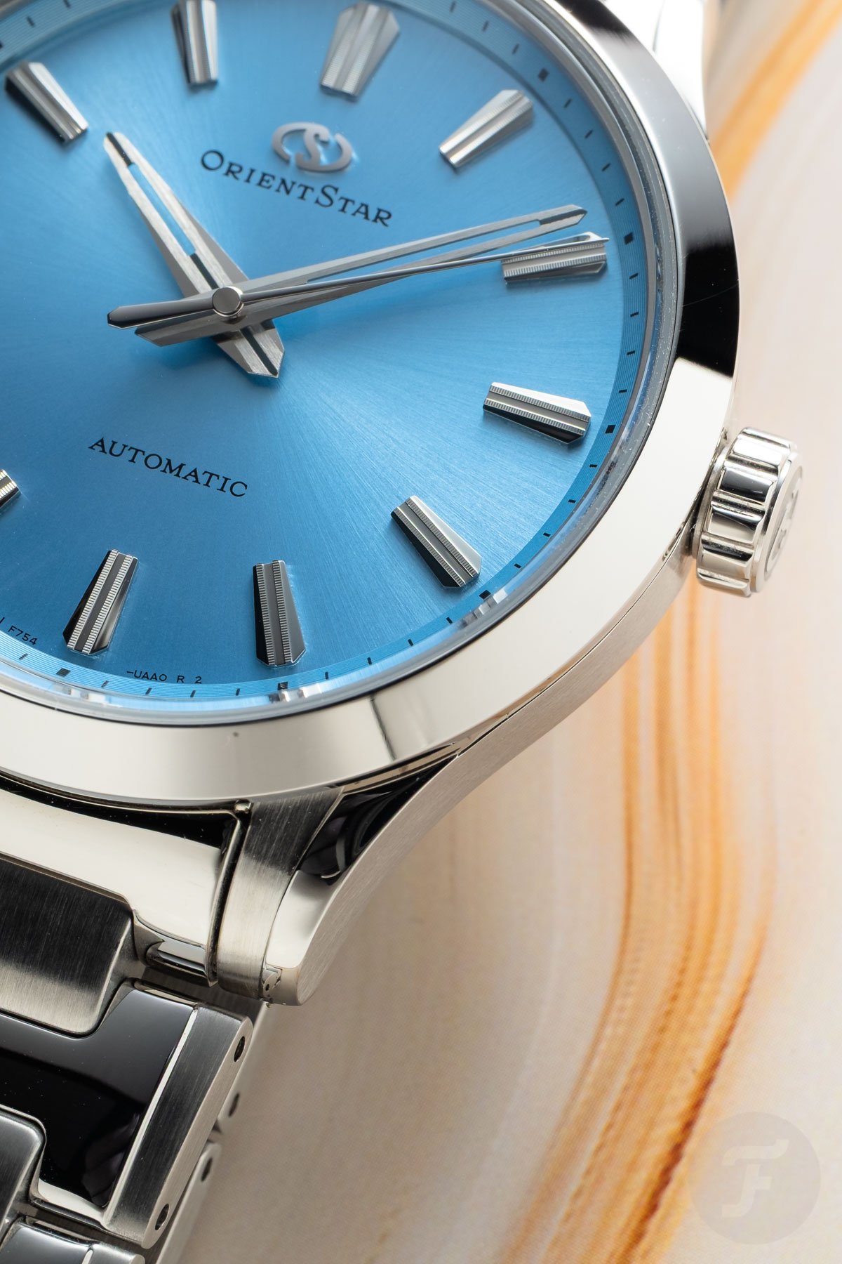 blue-dial Orient Star Sakigake Three Hand dial and bezel up close