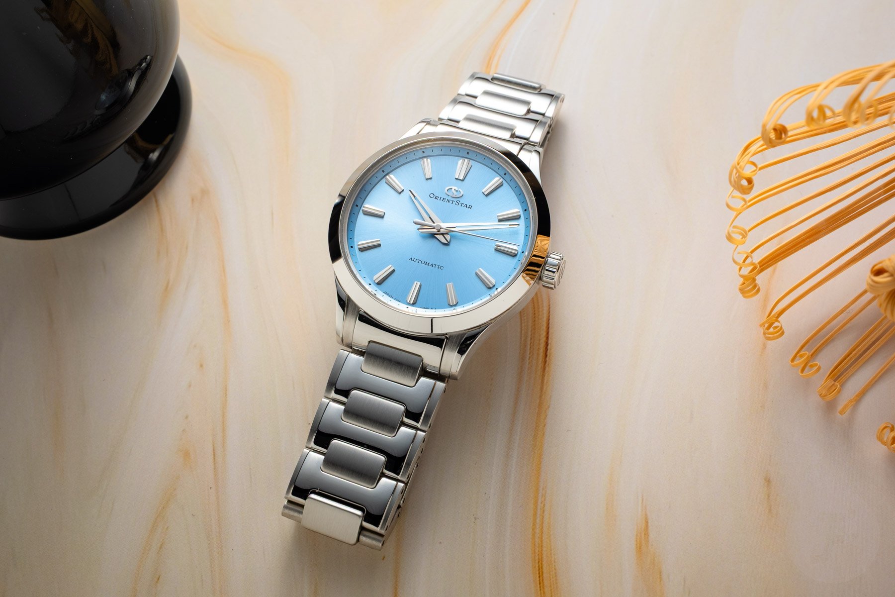blue-dial Orient Star Sakigake Three Hand flat-lay