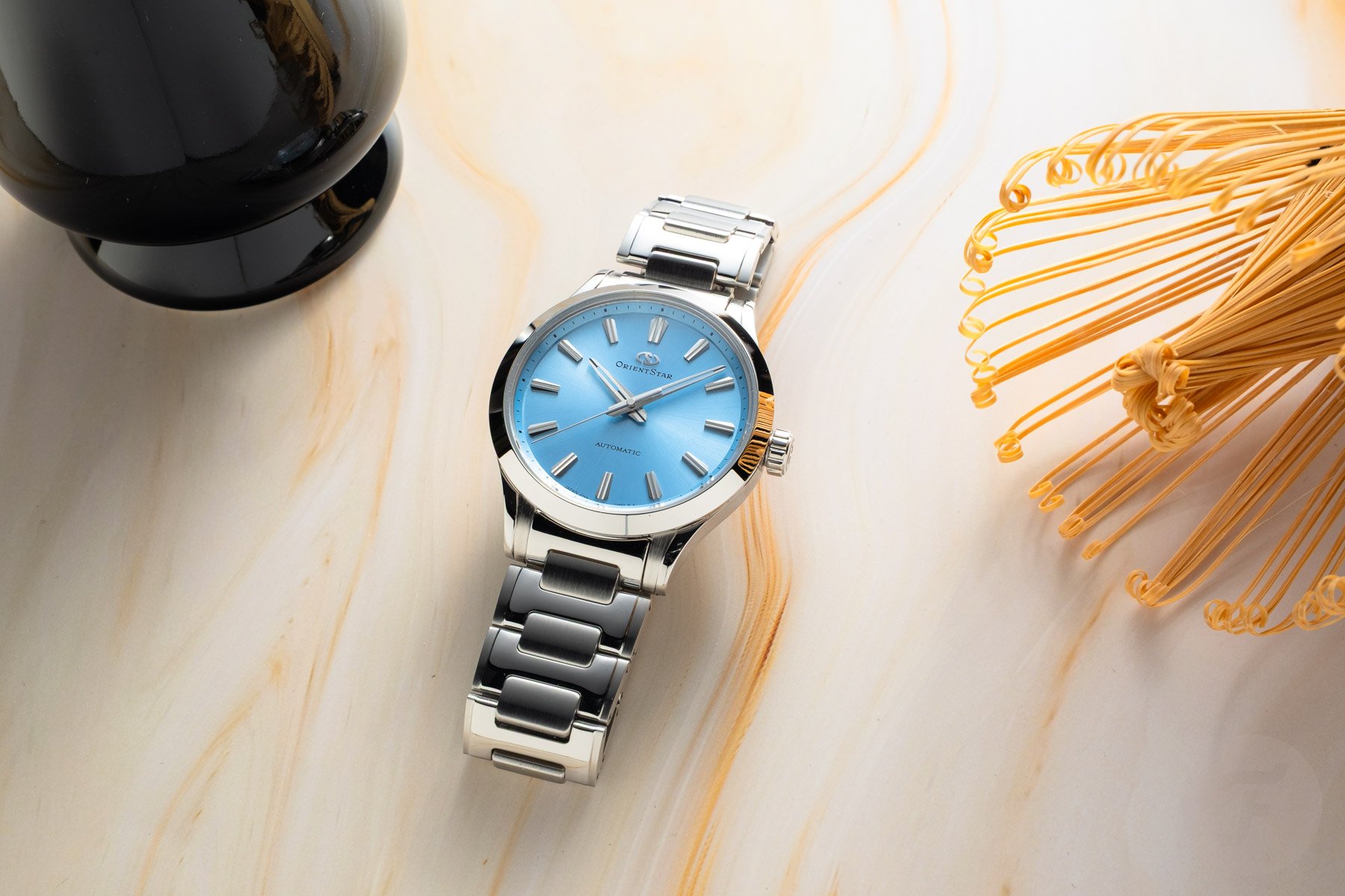 blue-dial Orient Star Sakigake Three Hand flat-lay