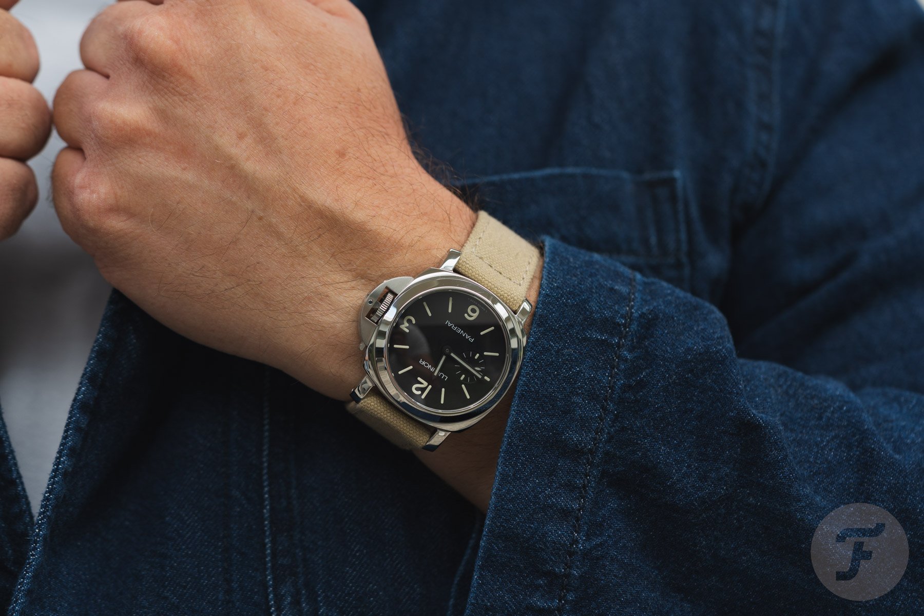 Panerai Luminor PAM01710 on wrist, hands on lapel
